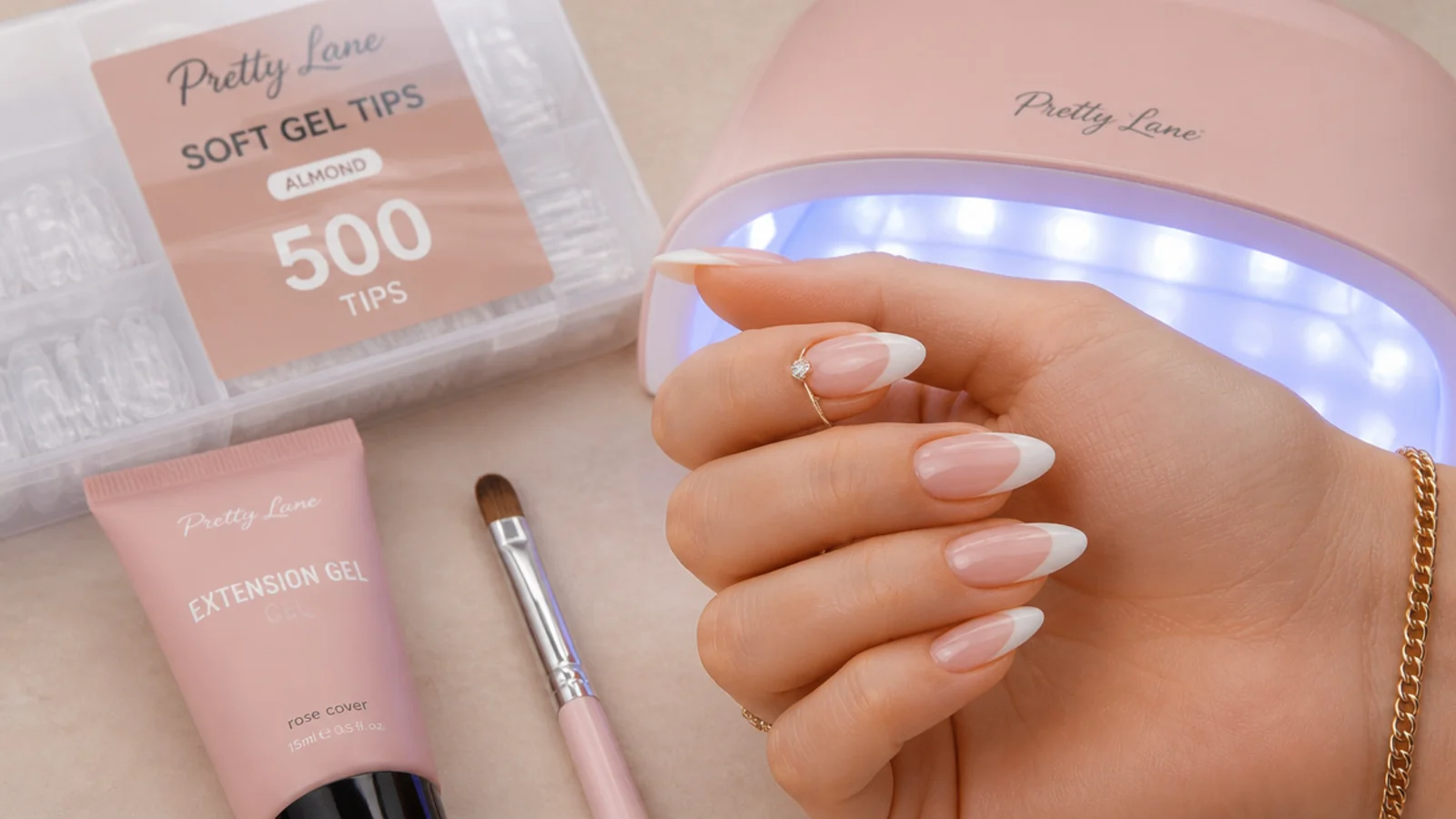 Soft gel extension kit with 500 clear almond tips in a sizing tray, extension gel and a small LED lamp