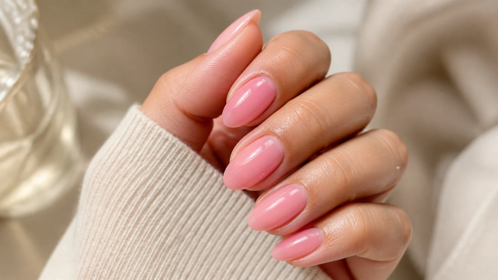 Translucent pink jelly nails showing the natural nail glowing through a glossy tinted overlay