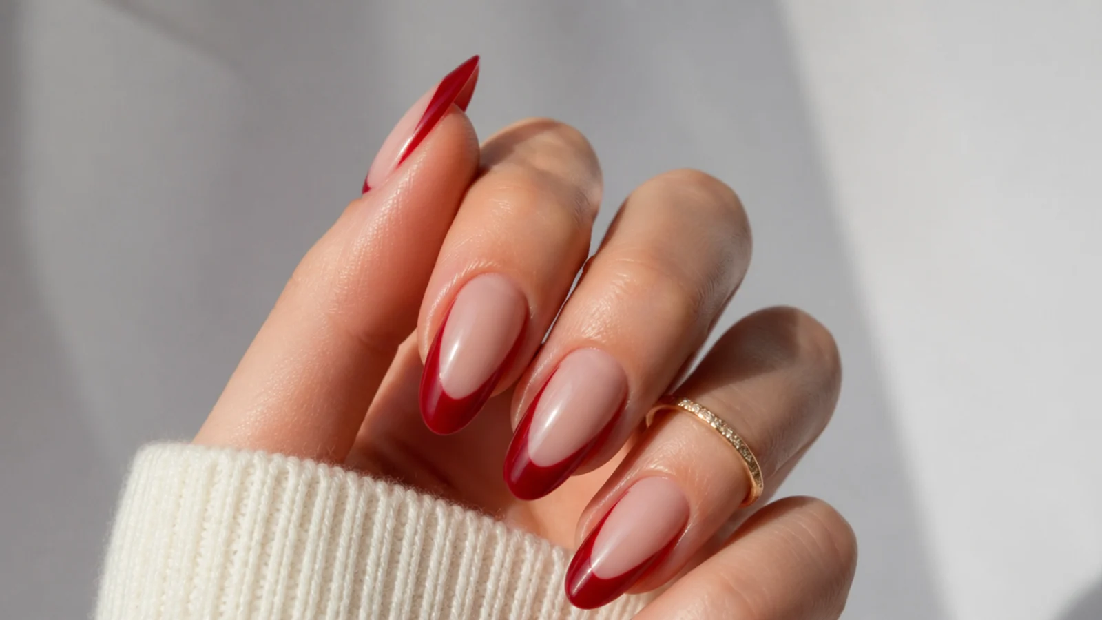 Sheer warm red negative space almond acrylic nails