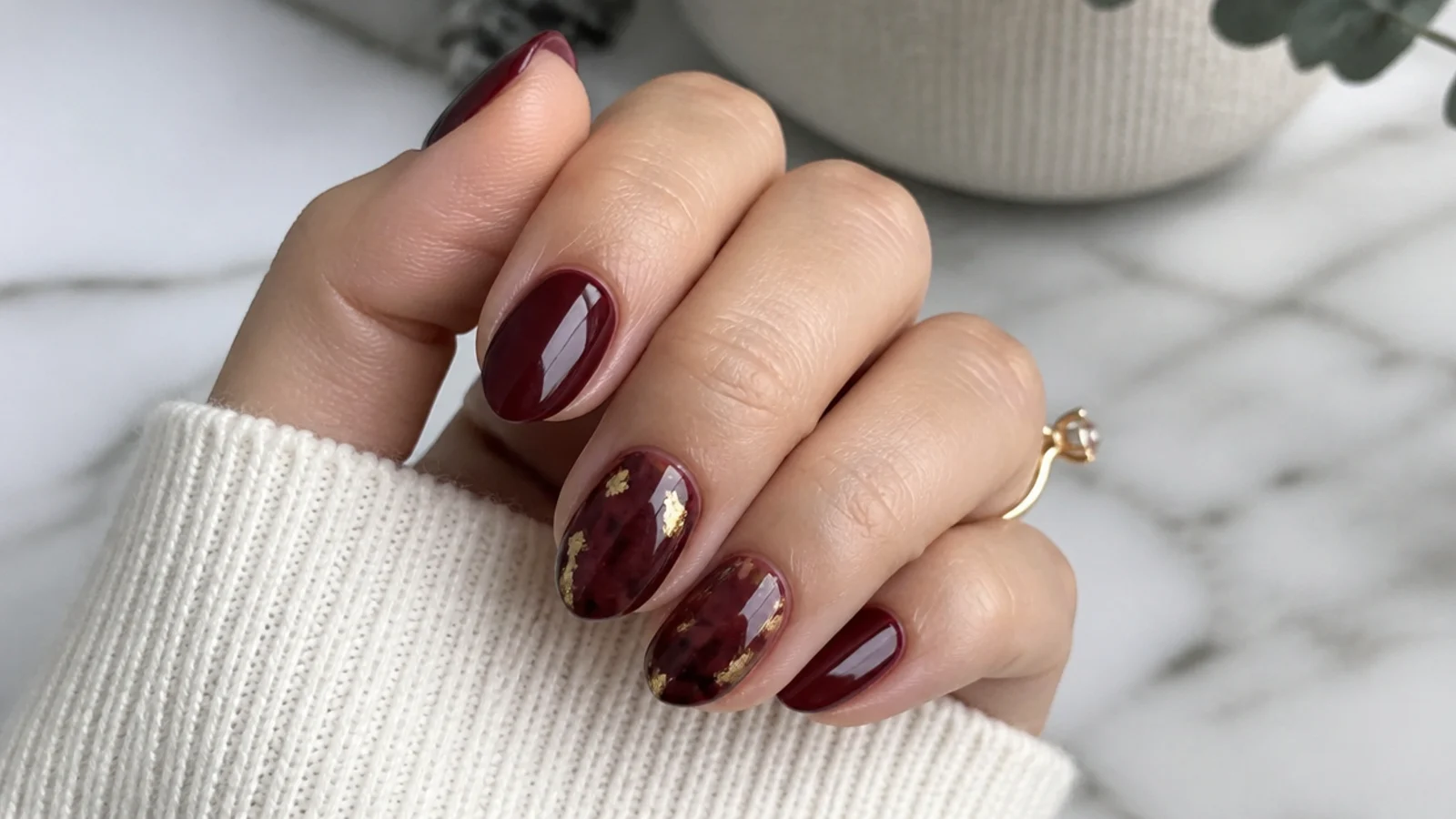 Short oxblood almond acrylic nails at a work-appropriate length