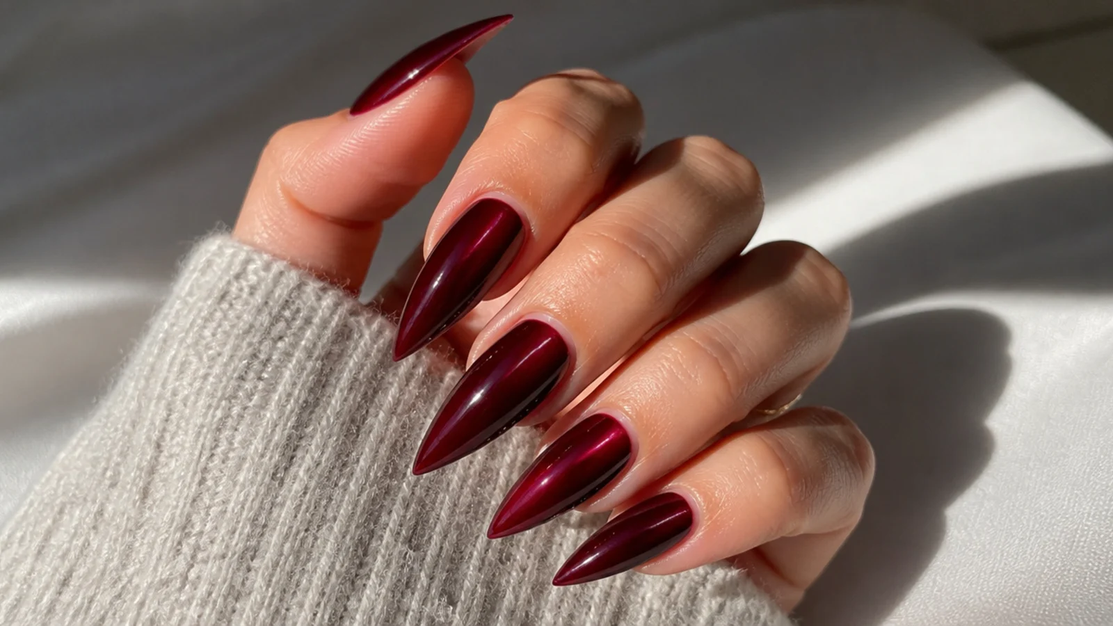 Deep wine red stiletto dark feminine nails with a sharp point