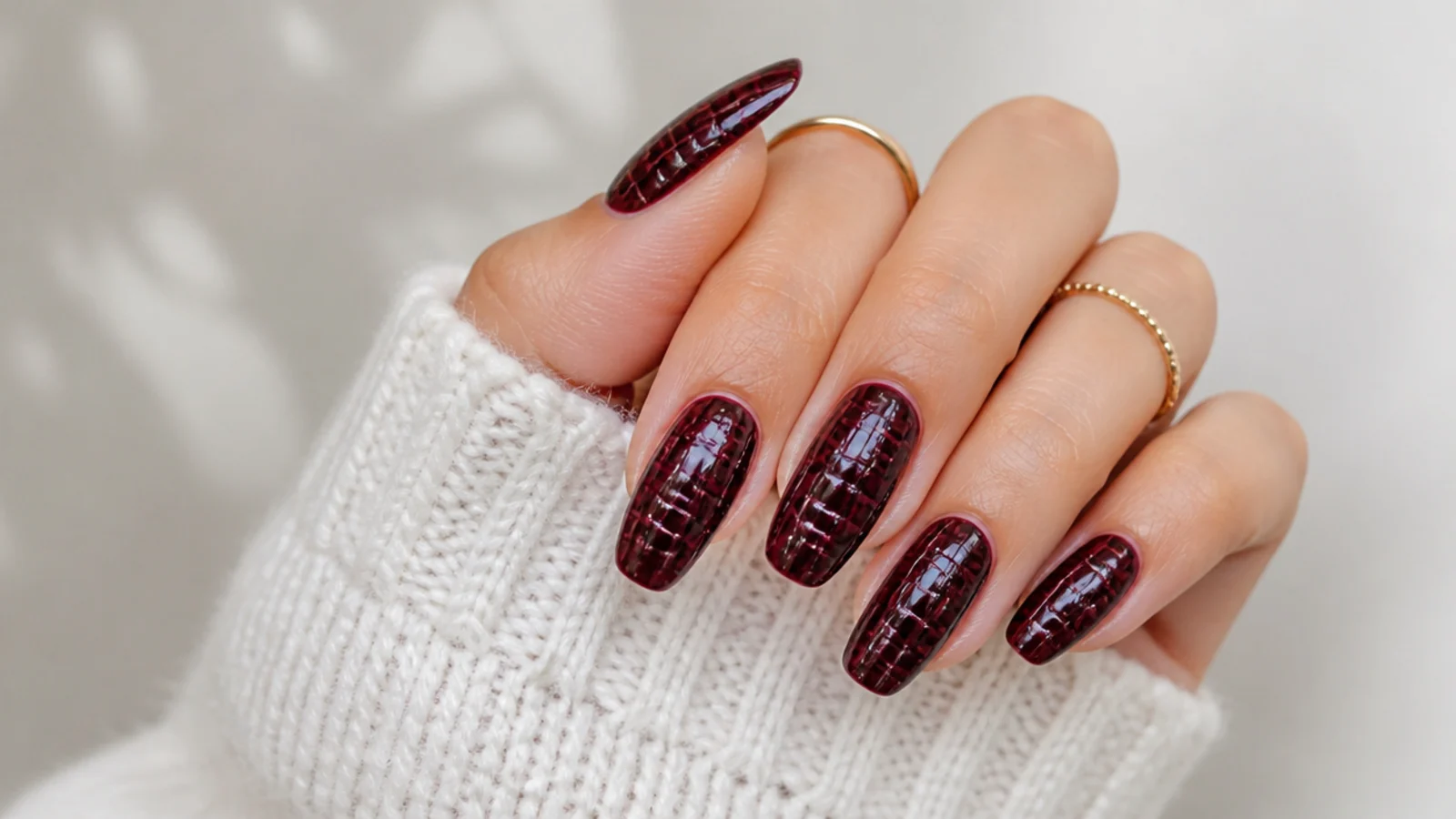 Deep burgundy dark feminine nails with a subtle crocodile texture pattern