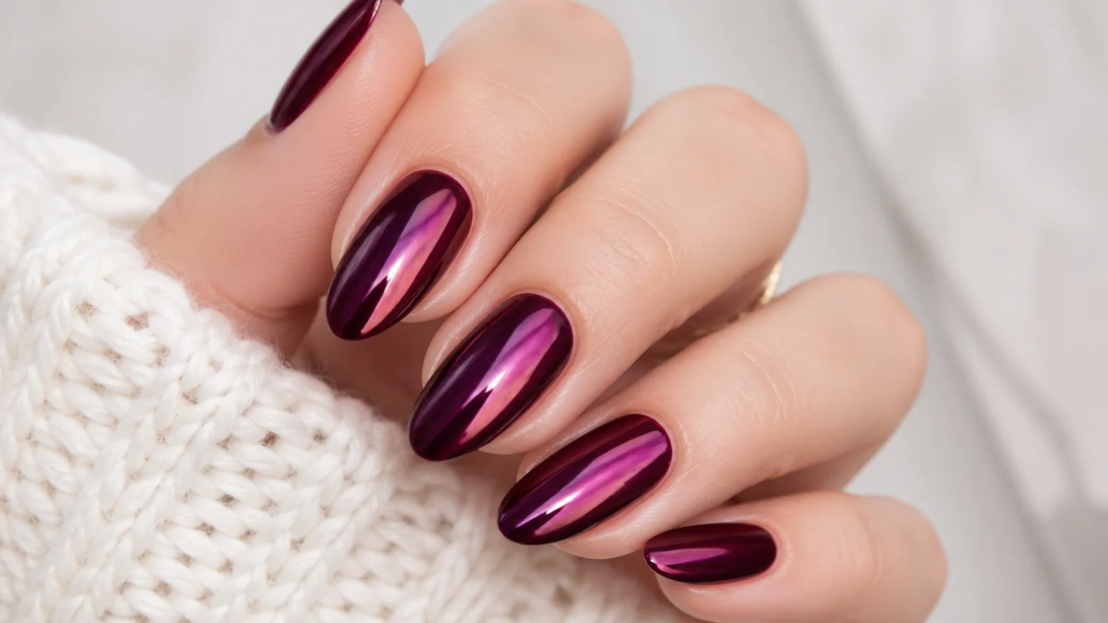 Deep berry chrome mirror dark feminine nails with a metallic sheen