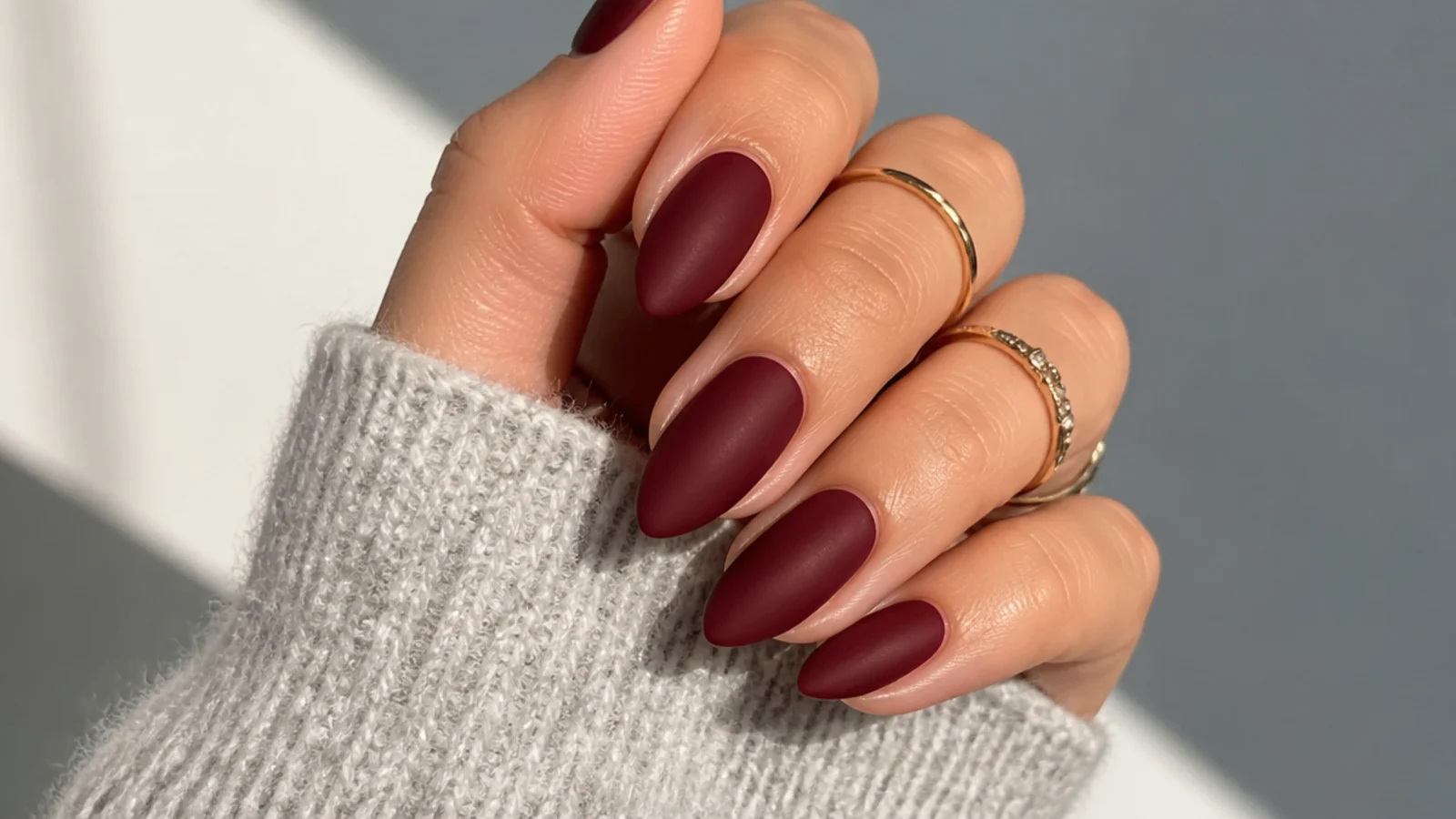 Matte oxblood almond dark feminine nails with a velvety flat finish