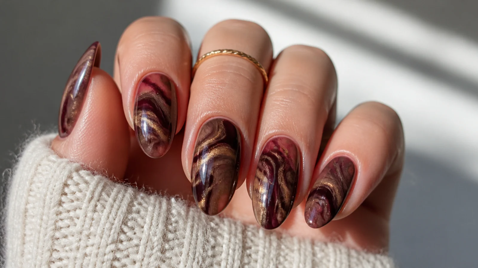 Dark feminine nails with swirling chocolate and berry marble tones