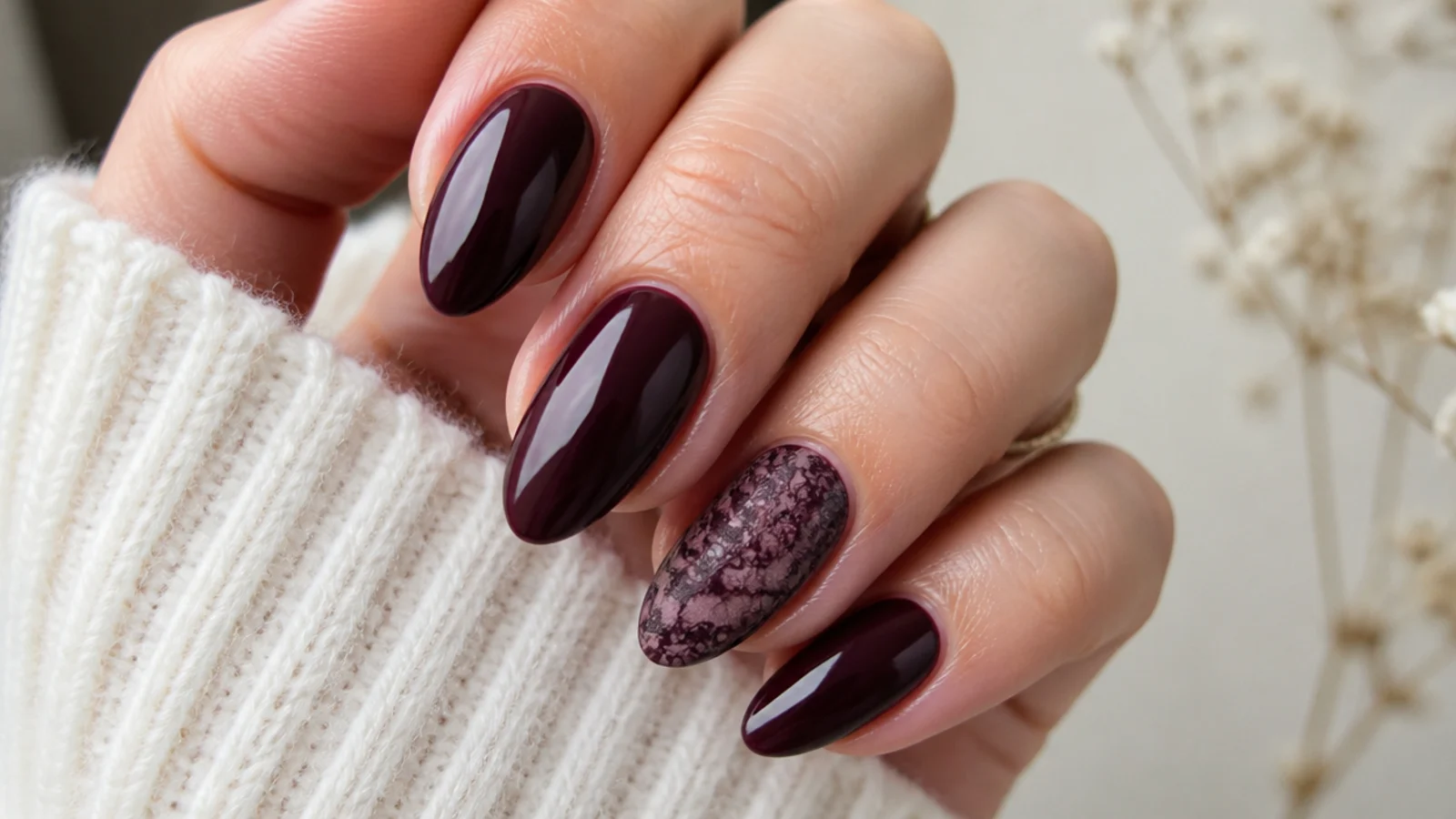 Deep plum dark feminine nails with a delicate tonal lace pattern accent