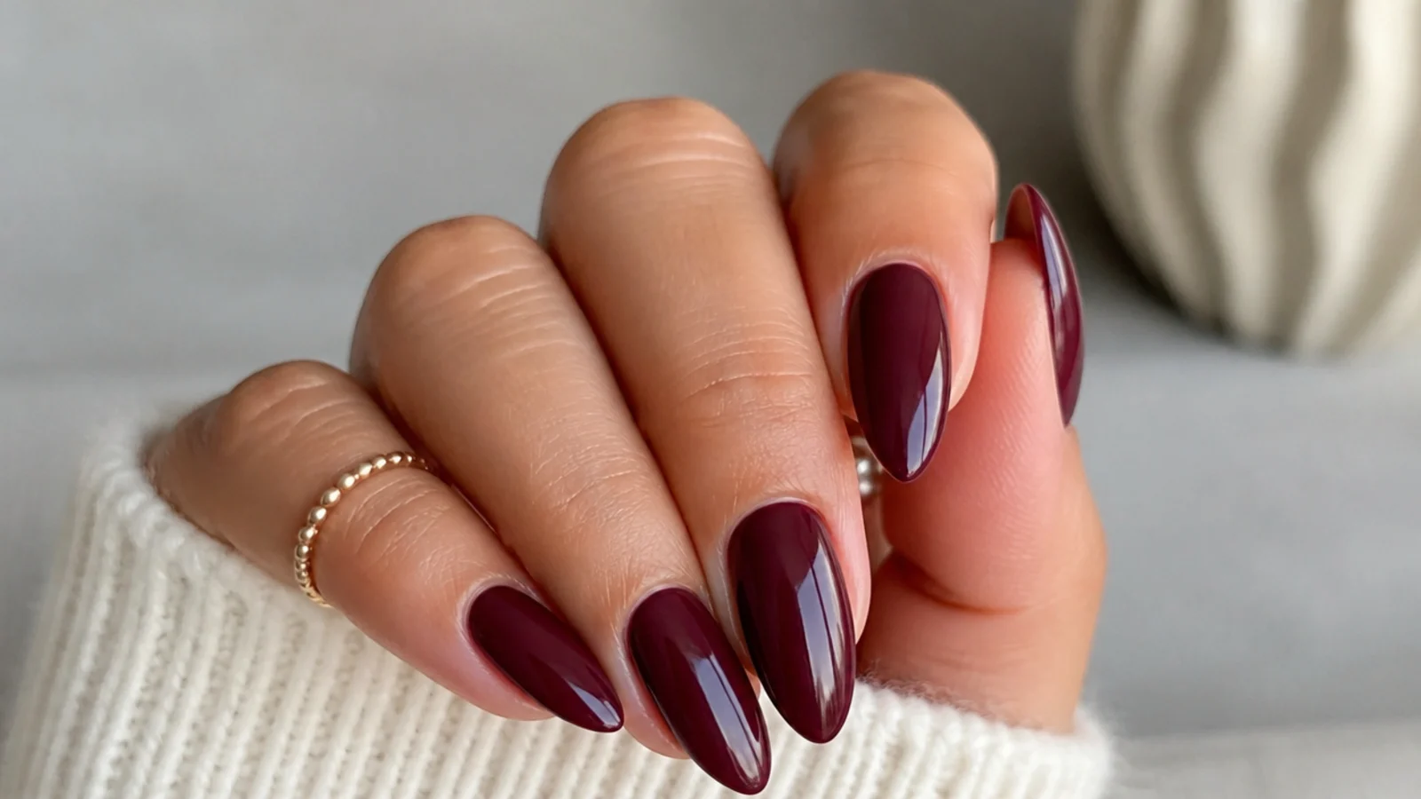 Creamy deep berry almond nails with a smooth finish