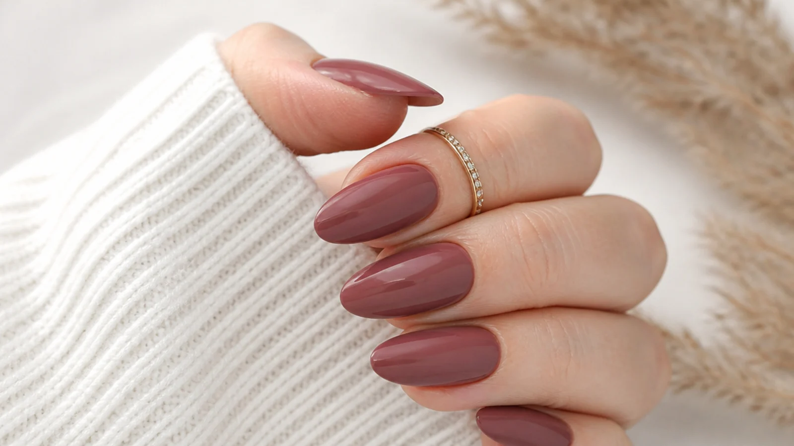 Dusty moody mauve almond nails with a soft creme finish