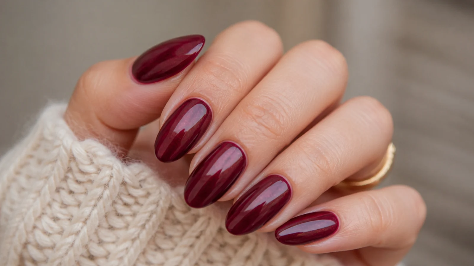 Glossy deep cranberry almond nails with a glazed shine