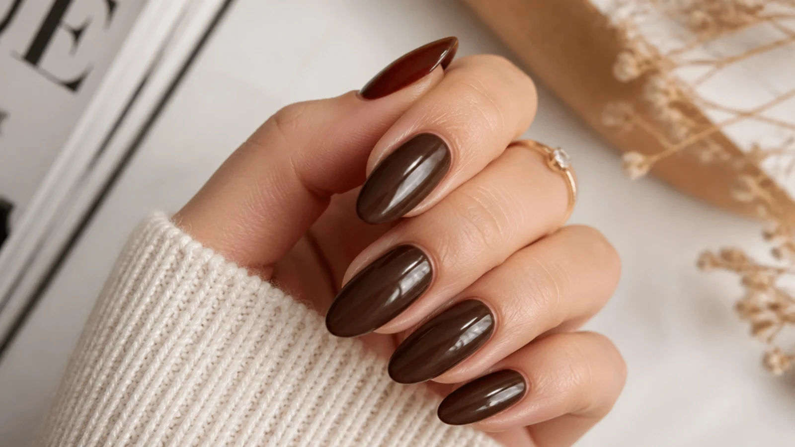 Glossy espresso brown almond nails with a smooth finish