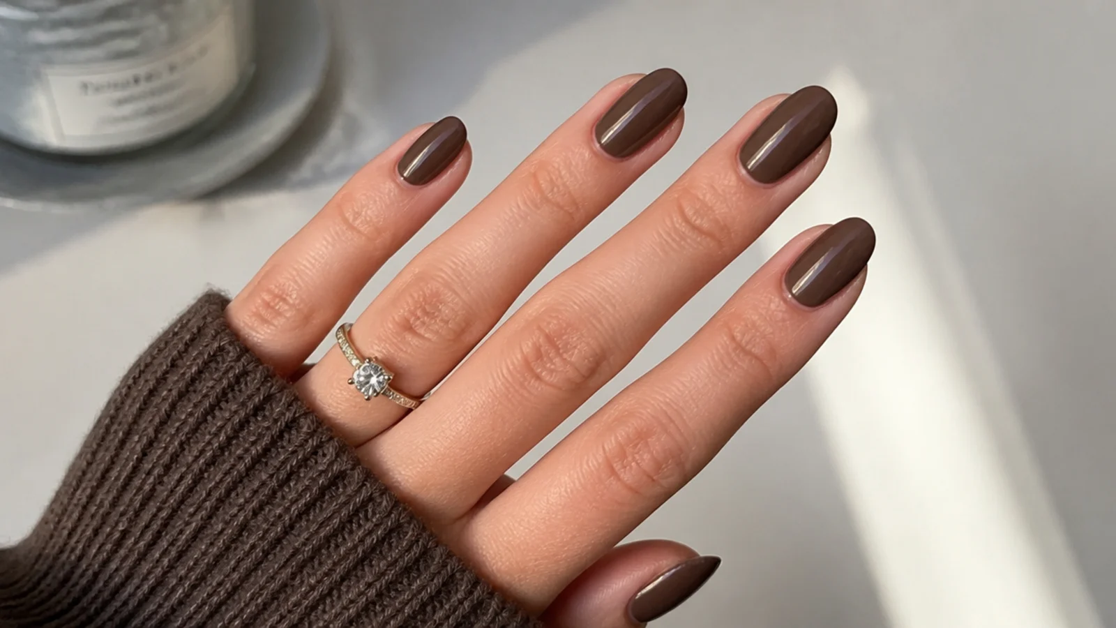 Glossy chocolate brown almond nails, short and office-appropriate