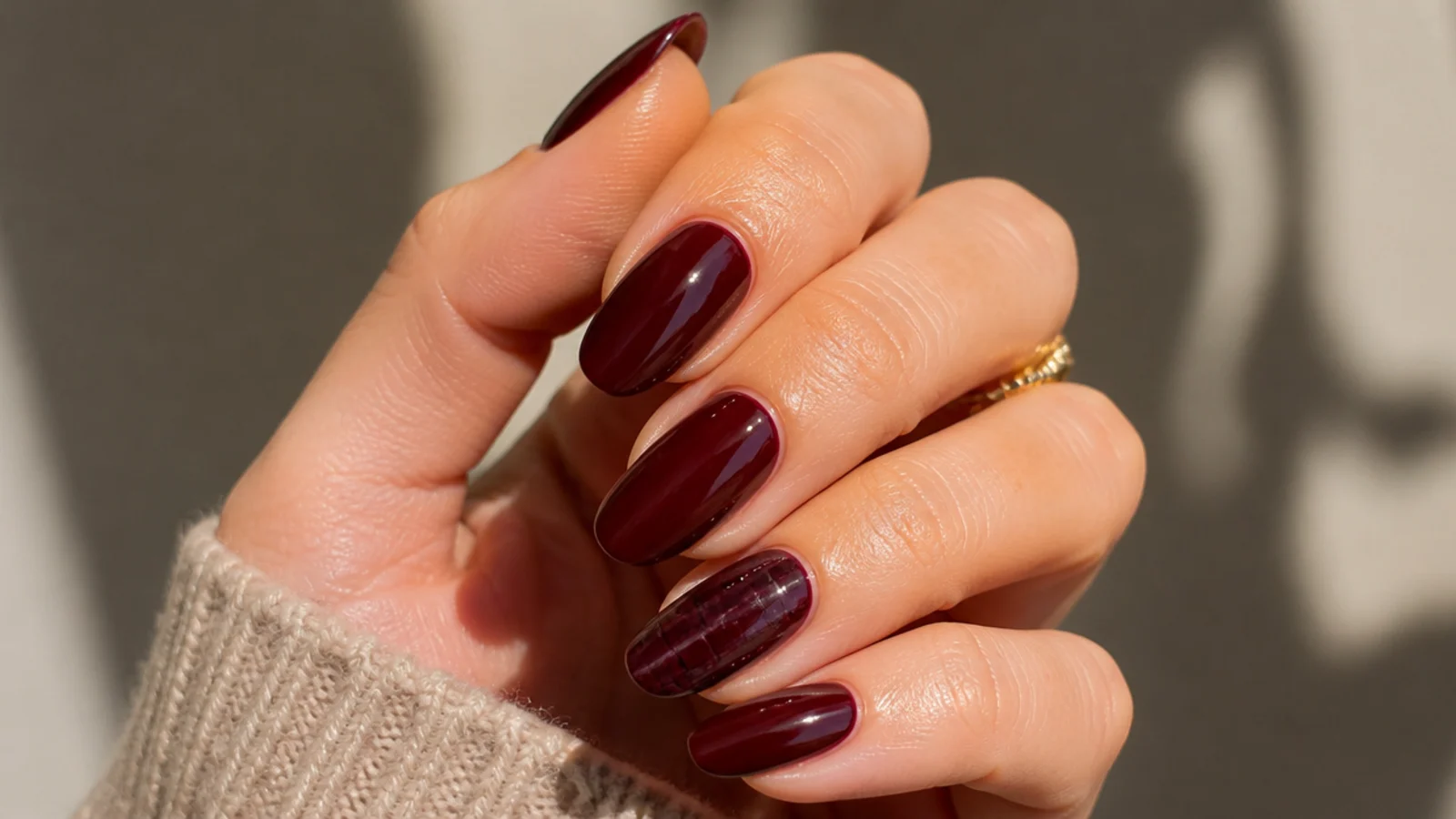 Oxblood nails with a subtle tonal croc-skin textured accent nail