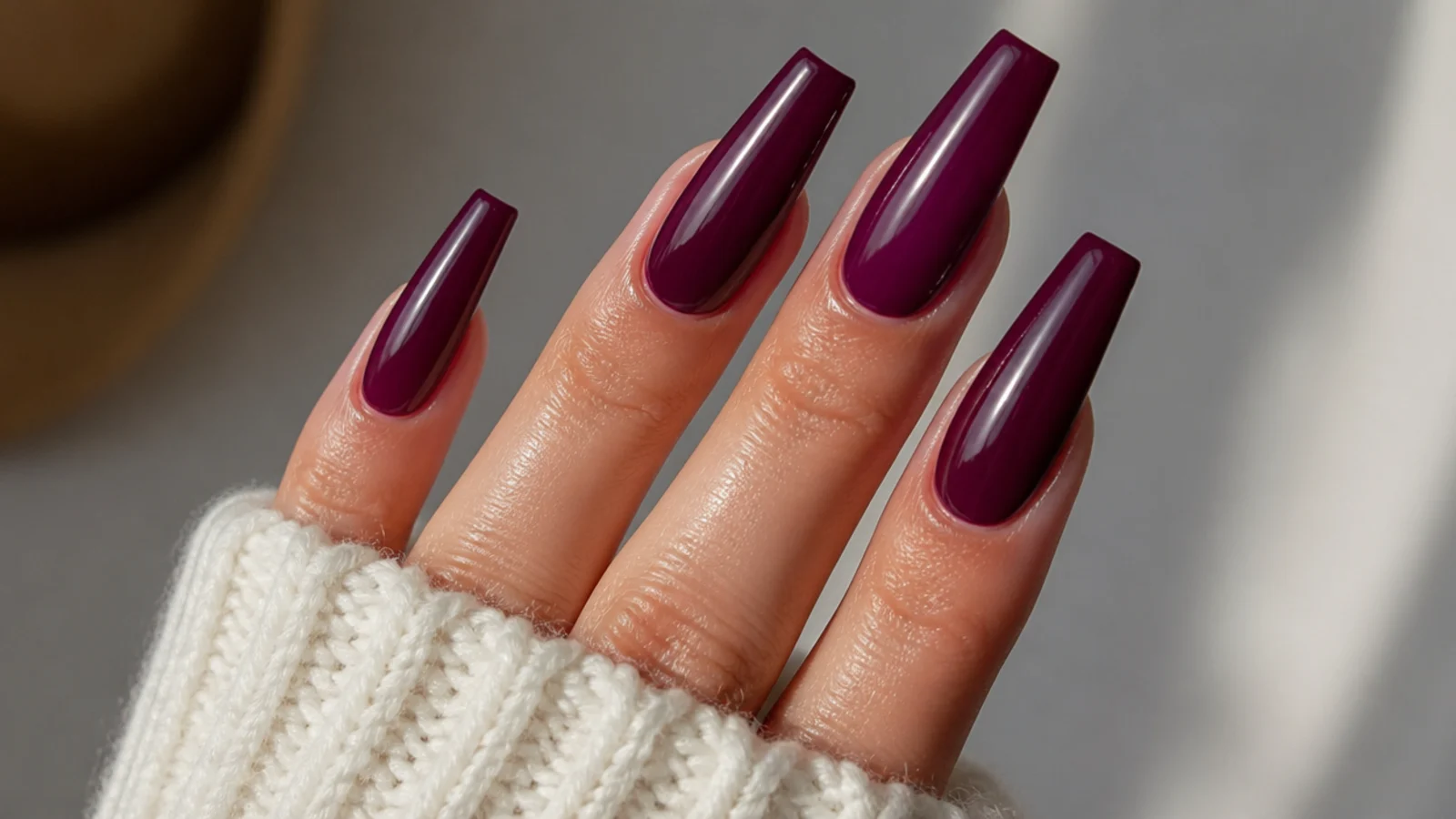 Coffin nails in glossy deep berry with a glazed high-shine finish