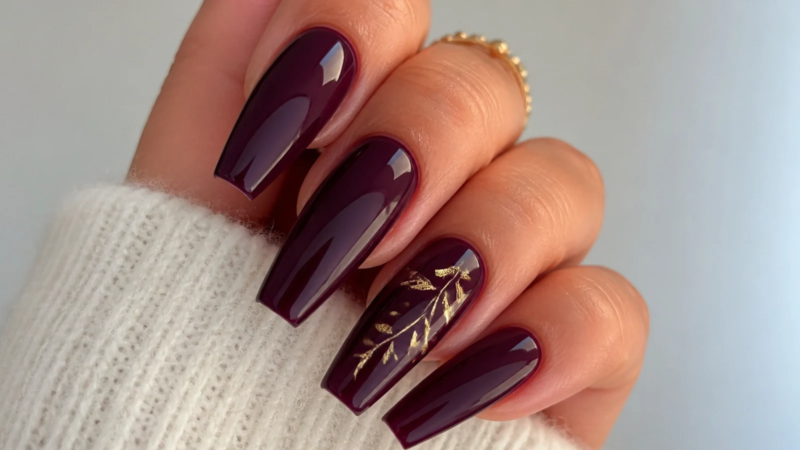 Coffin nails in a deep glossy blackberry with warm purple undertones