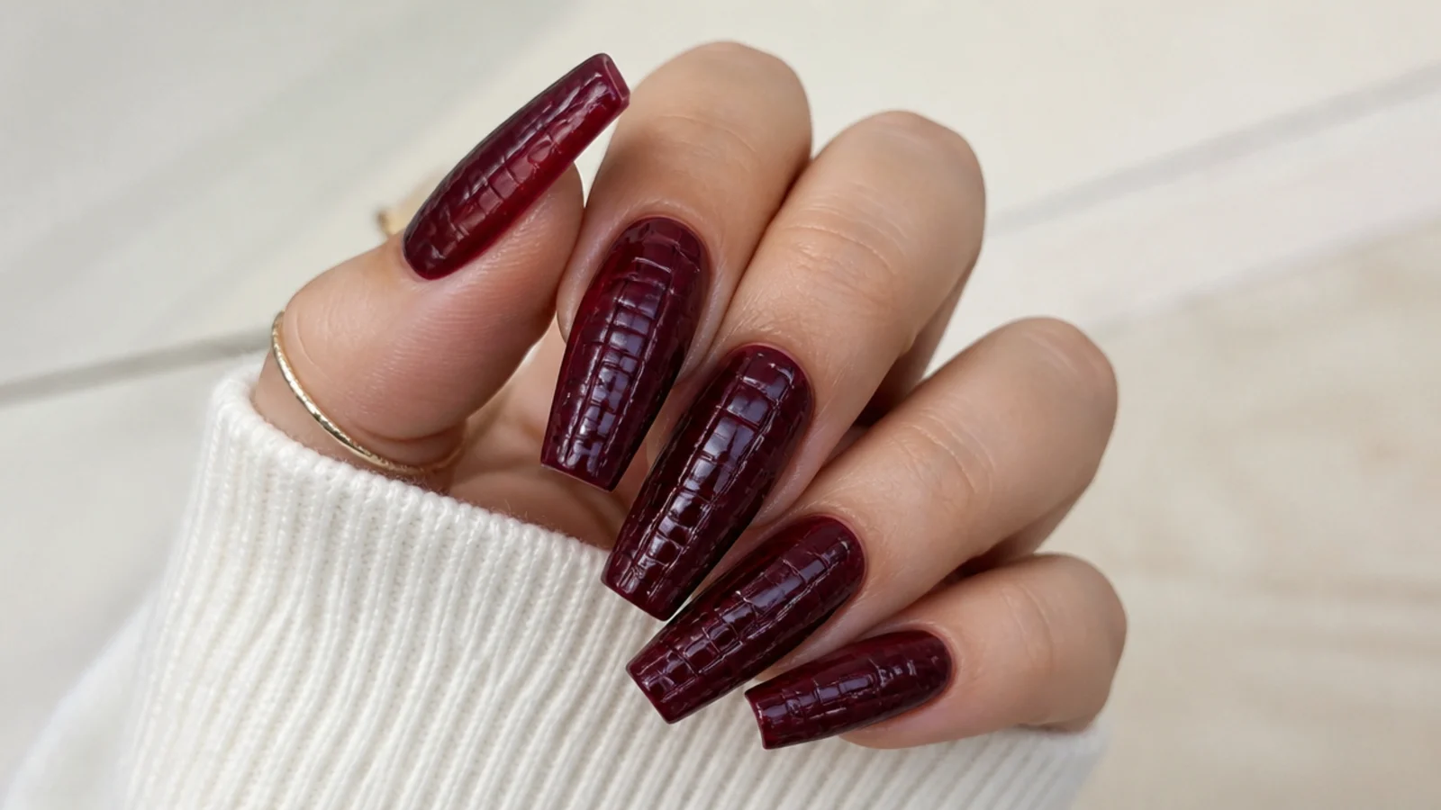 Coffin nails in deep burgundy with a subtle 3D croc-embossed texture