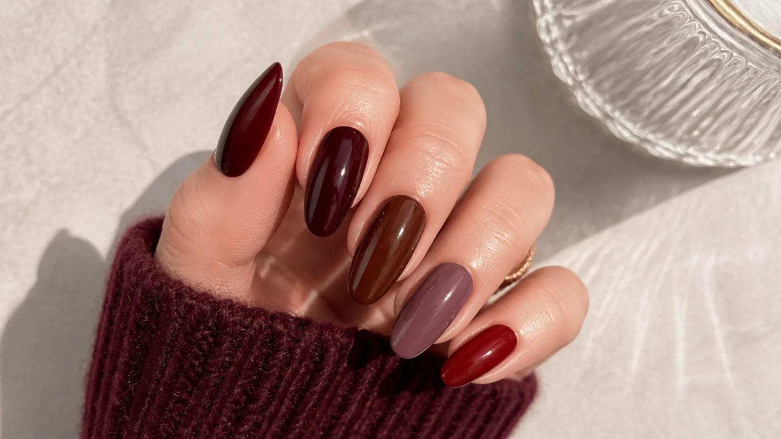 Swatches of oxblood, berry, wine, chocolate brown, mauve and sheer warm red
