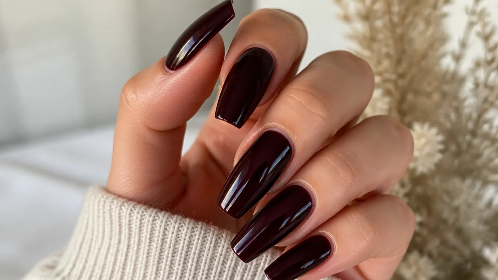 Deep plum coffin nails with a glossy near-black finish