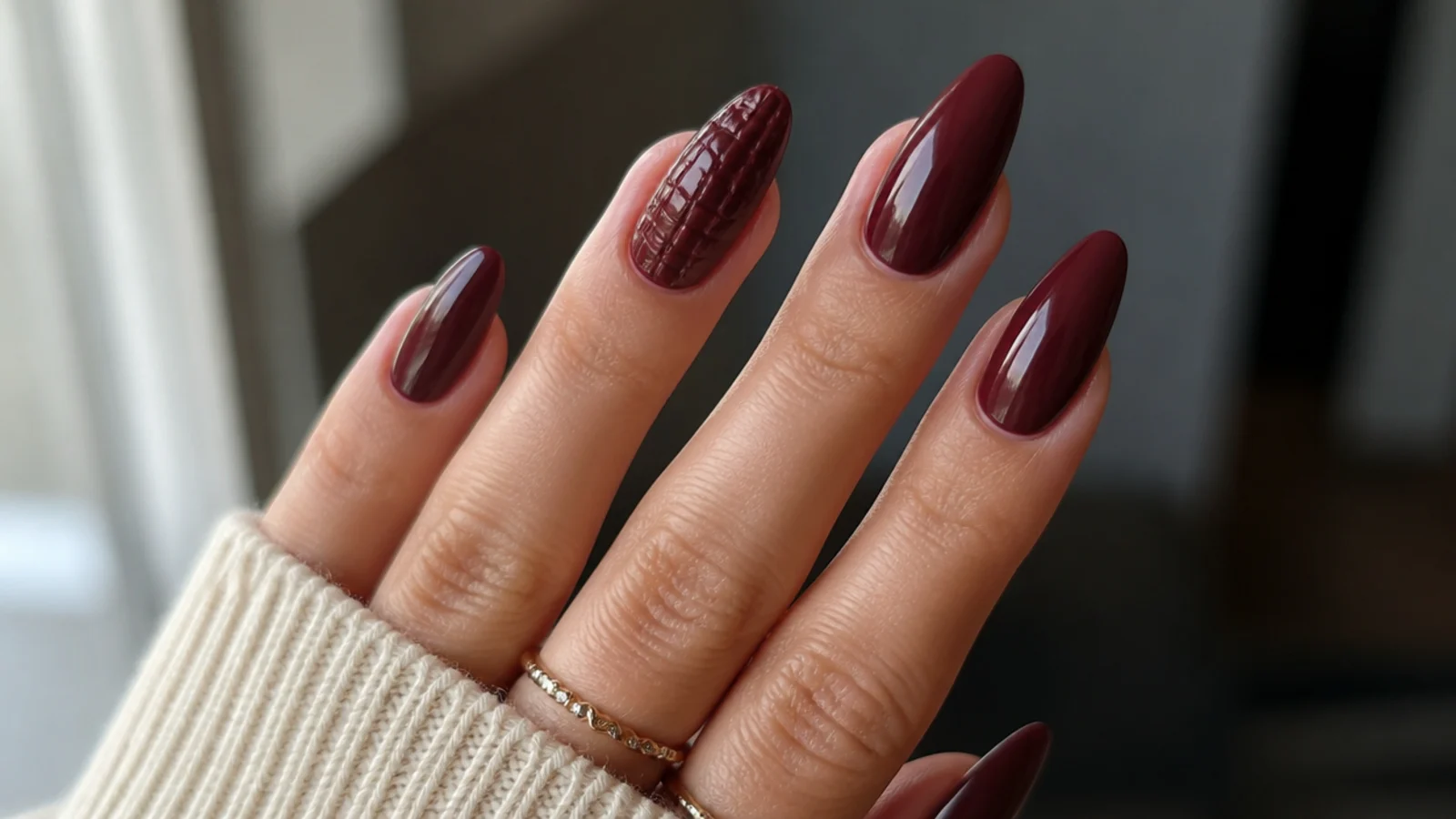 Oxblood nails with a subtle 3D croc-skin textured accent