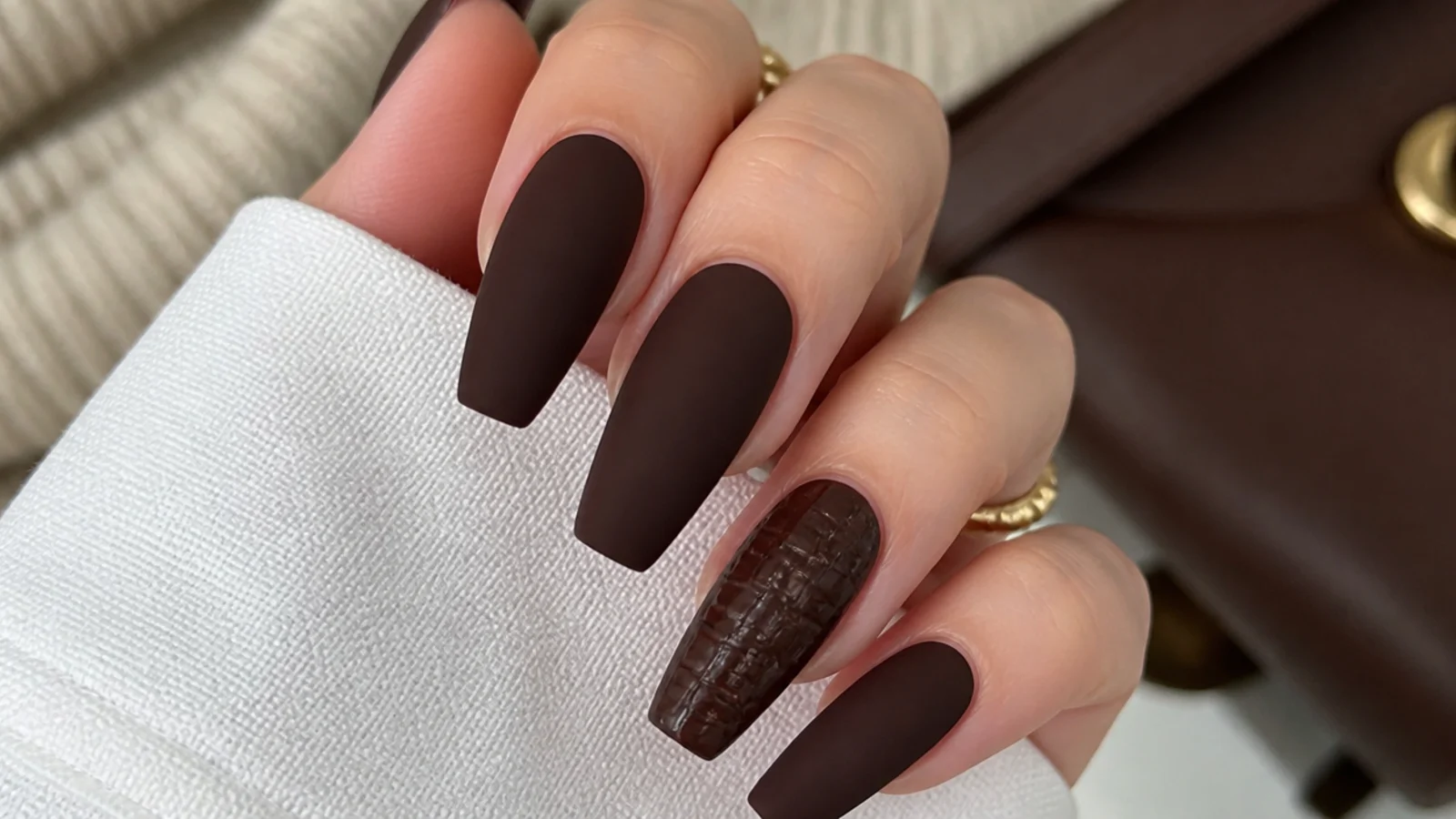 Matte chocolate brown nails with a tonal croc texture accent