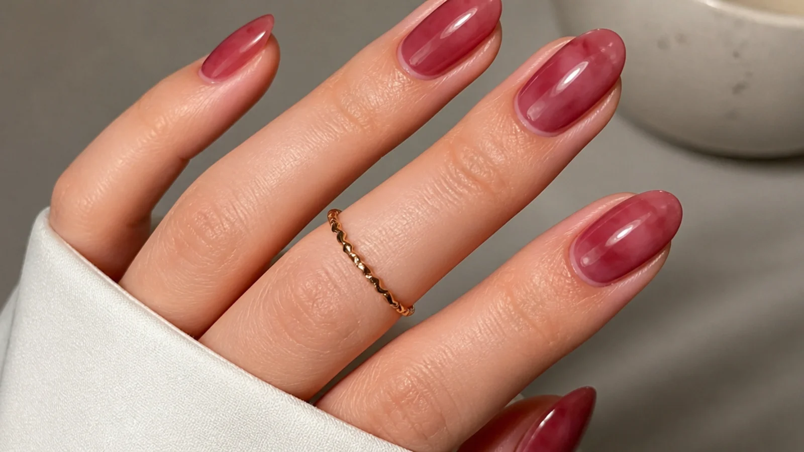 Milky sheer berry nails with a soft glossy translucent finish