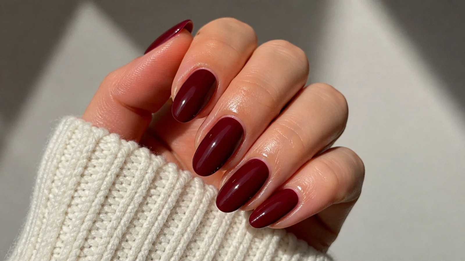 A sealed oxblood gel manicure with cuticle oil for longevity