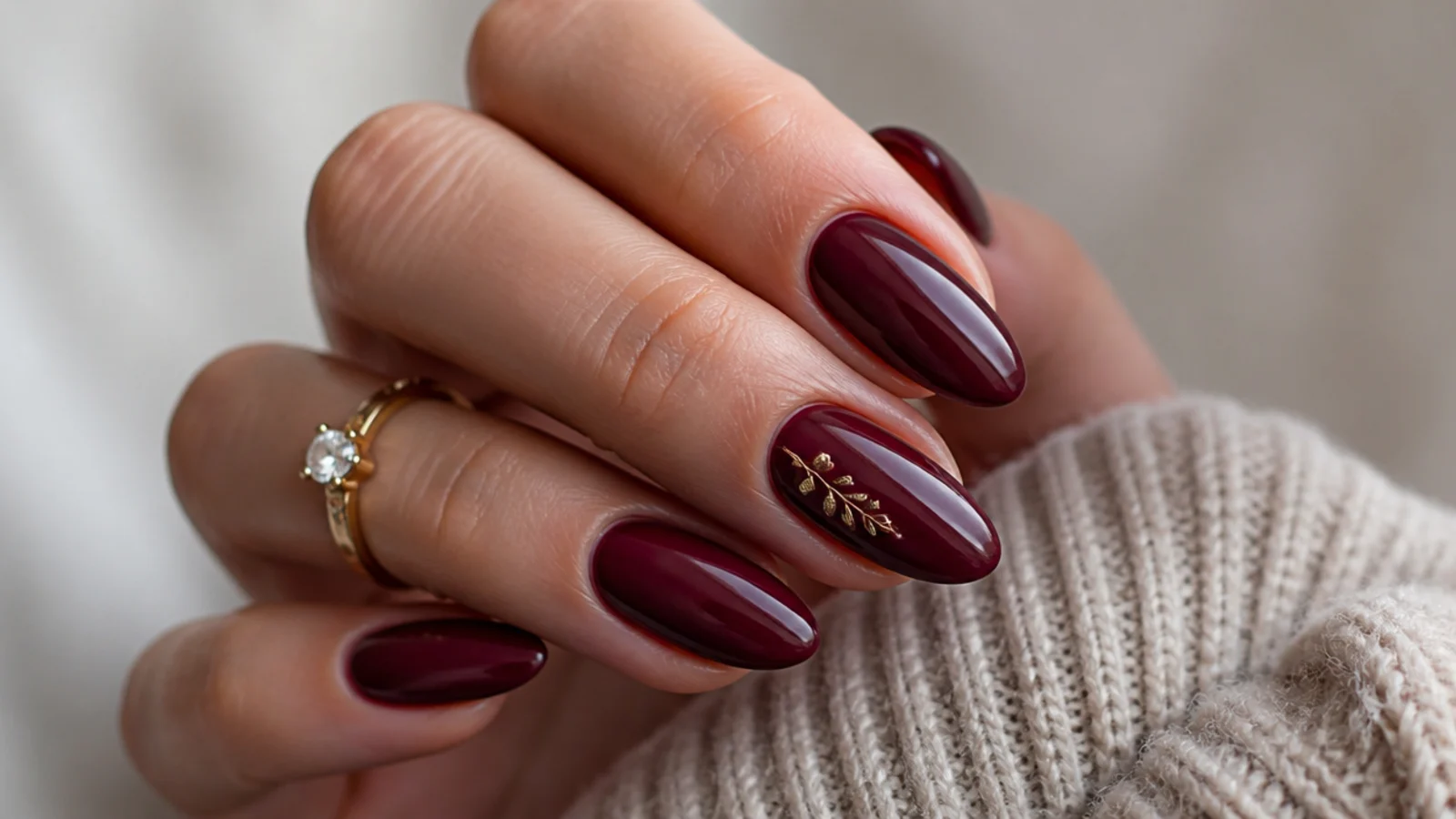 Deep berry and oxblood glossy nails showing the dark feminine aesthetic