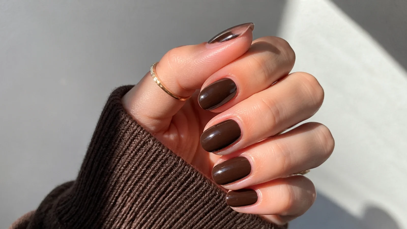 Glossy chocolate brown dark feminine nails on short almond nails