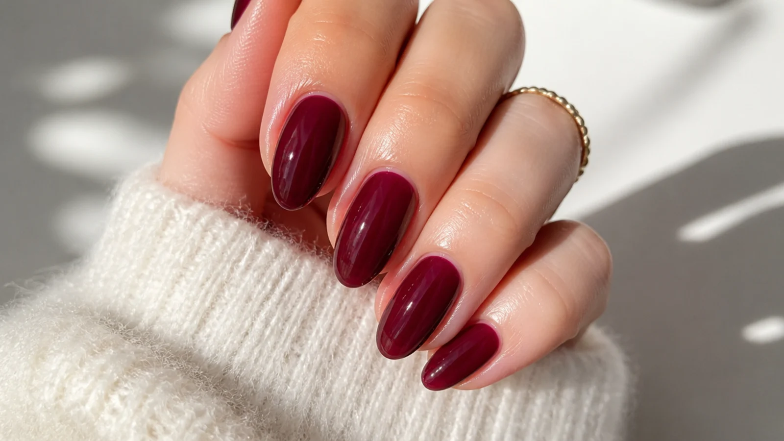 Sheer sangria red-purple jelly dark feminine nails with a glassy finish