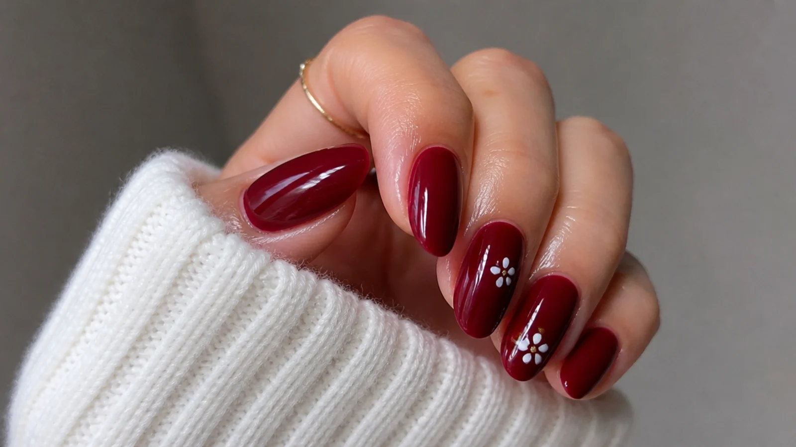 A well-sealed deep red gel manicure with cuticle oil for longevity