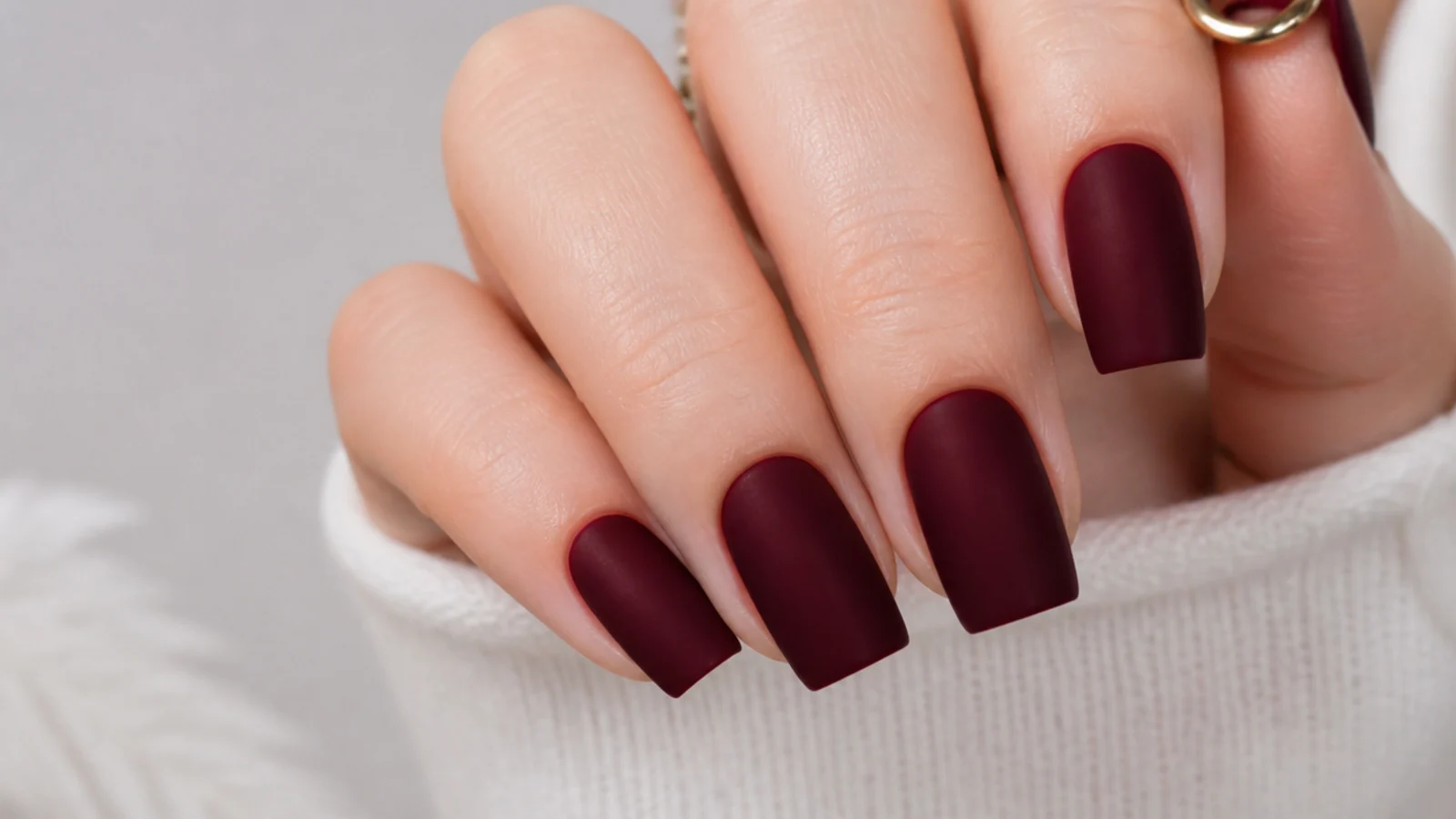 Deep oxblood square nails with a flat matte finish