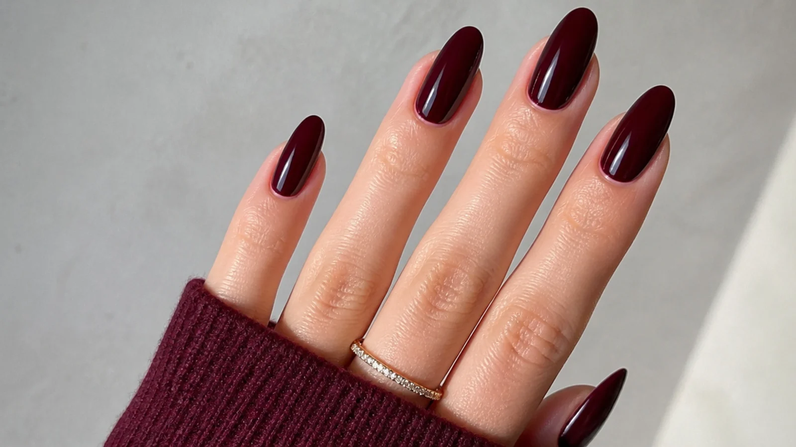 Deep berry and oxblood glossy nails showing the sultry dark feminine look