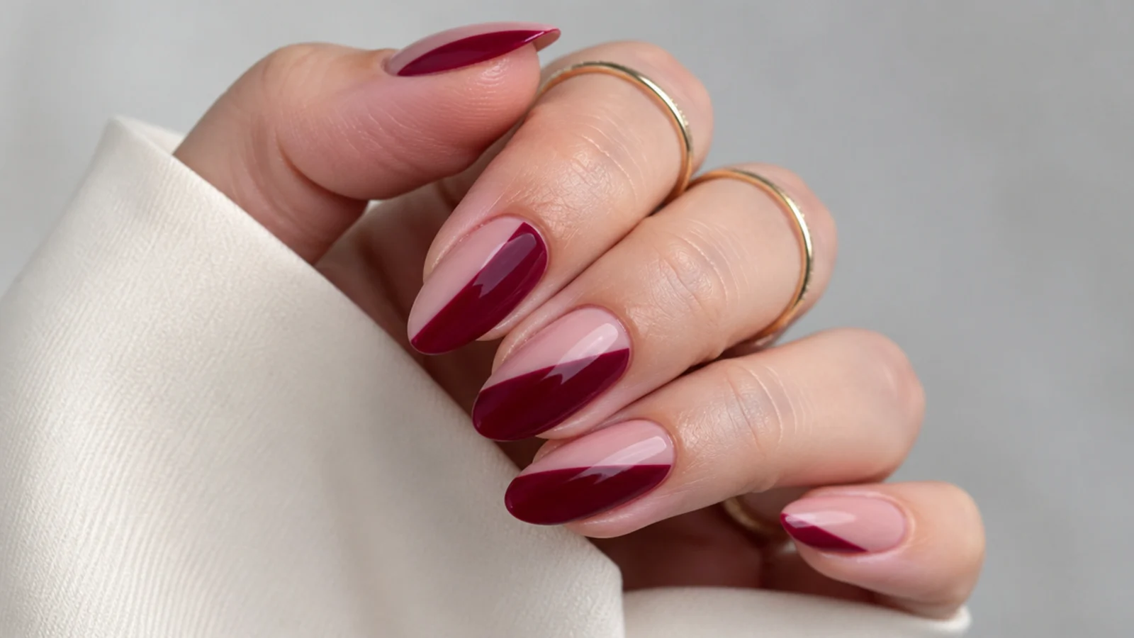 Berry negative space almond nails with bare skin-tone gaps