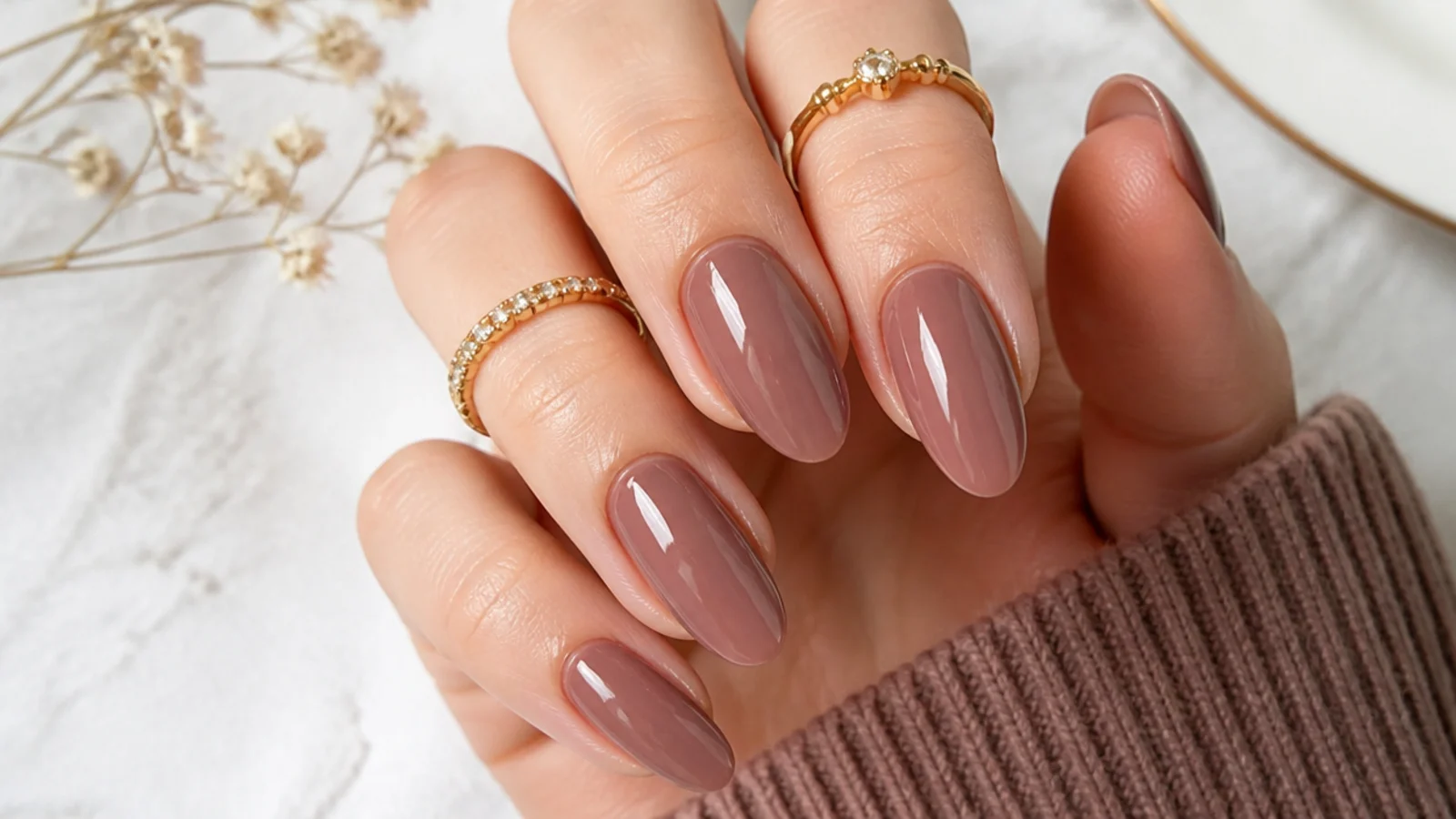 Dusty mocha mauve almond nails with a soft glossy finish
