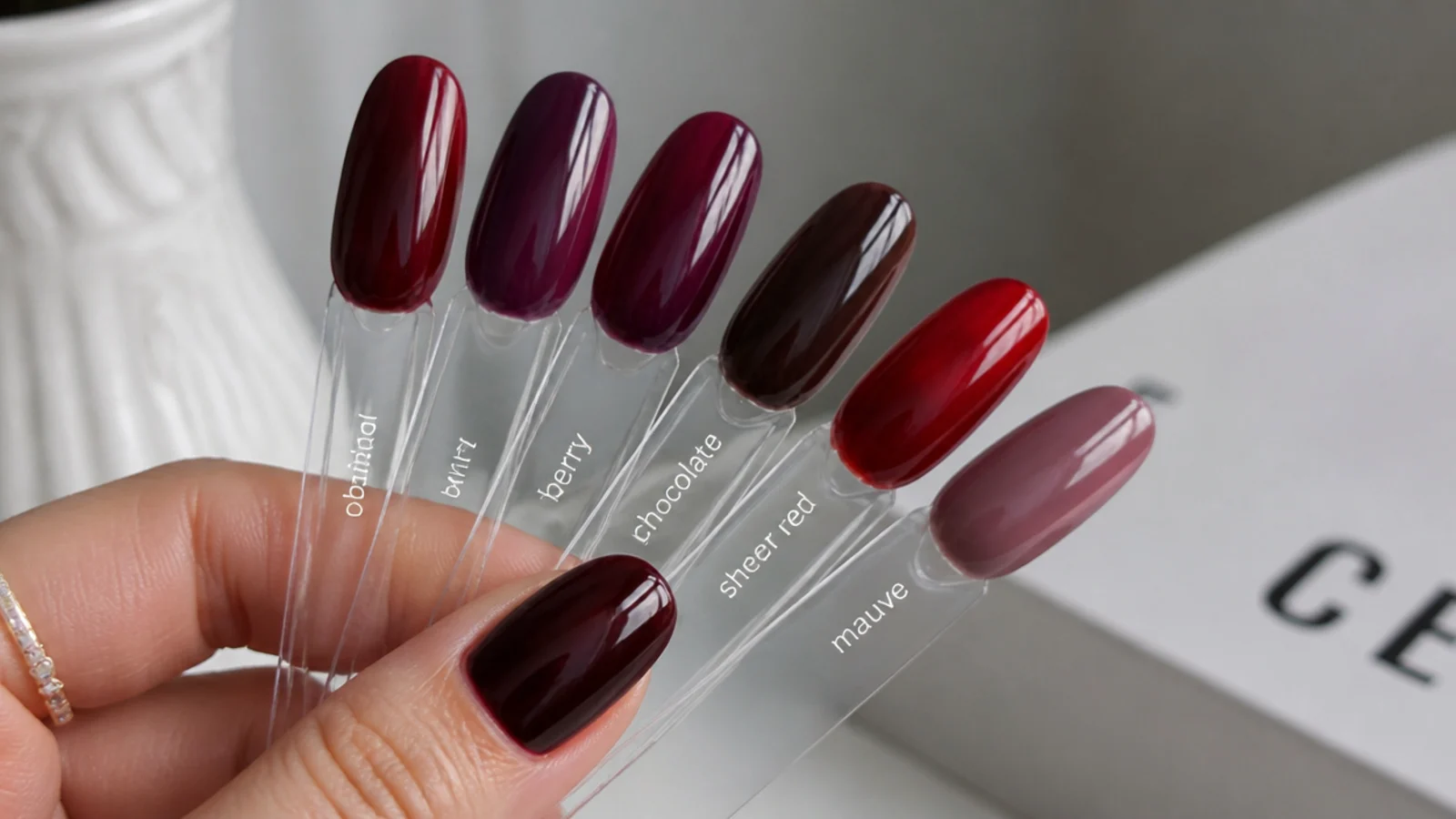 Swatches of oxblood, wine, berry, chocolate, sheer red and mauve gels