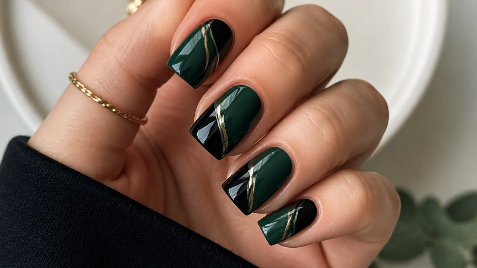 Dark green and black abstract swirl nails on a square shape