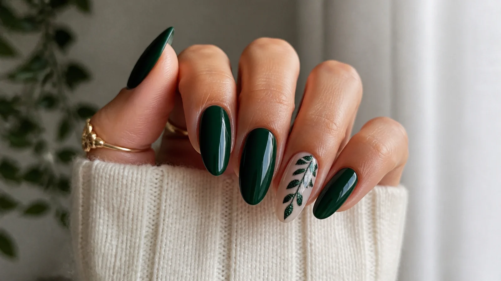 Long glossy emerald green nails on an almond shape