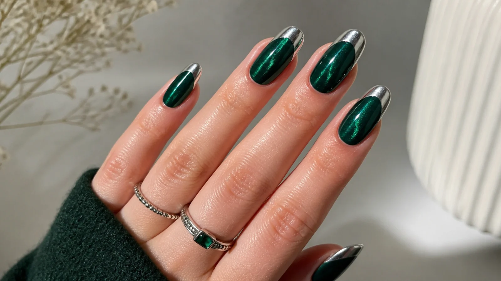 Emerald green acrylic nails with silver chrome french tips