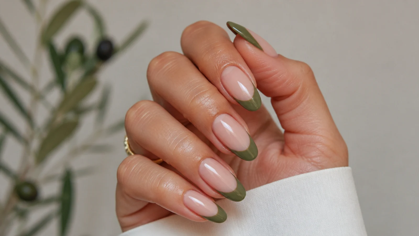 Nude acrylic nails with warm olive green french tips