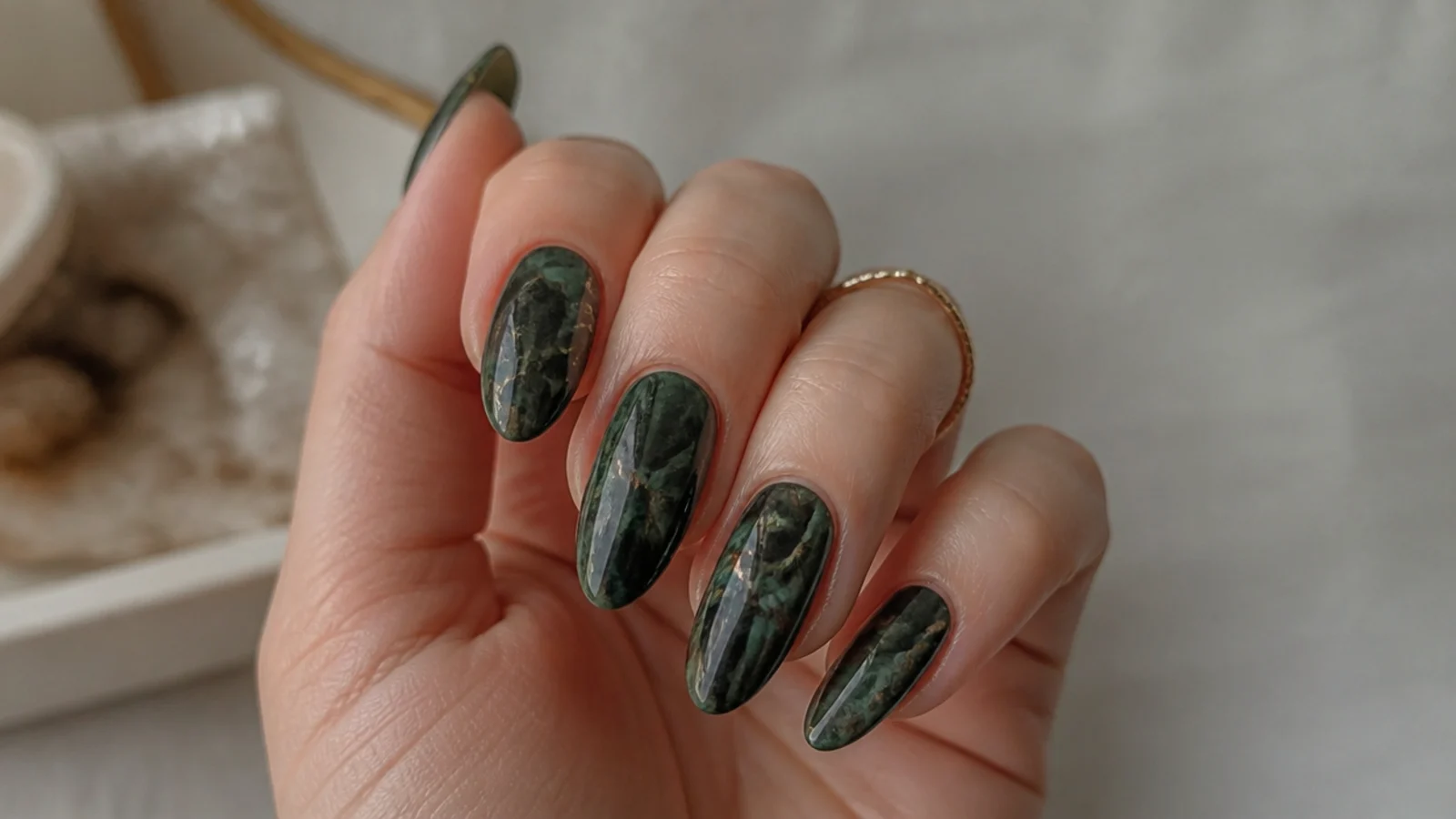 Dark green and black marble nails with smoky veining