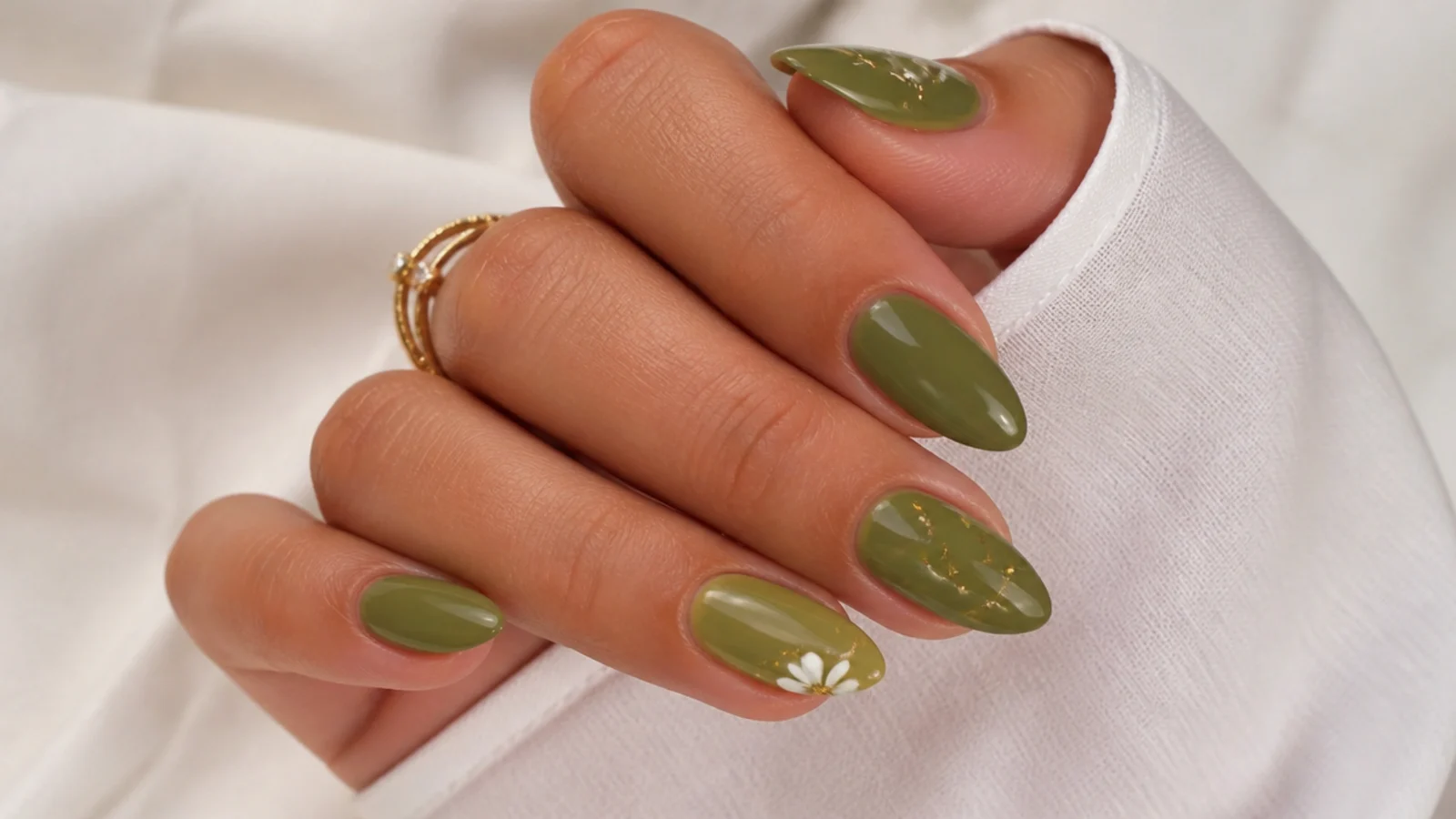 Warm olive green almond nails on tan skin