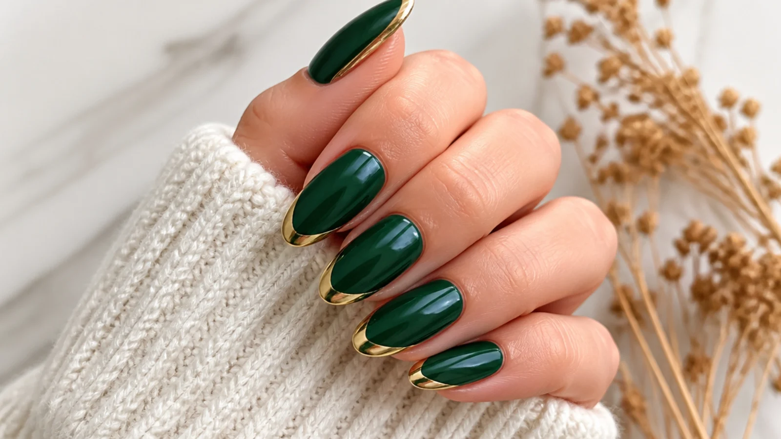 Forest green almond nails with metallic gold painted tips