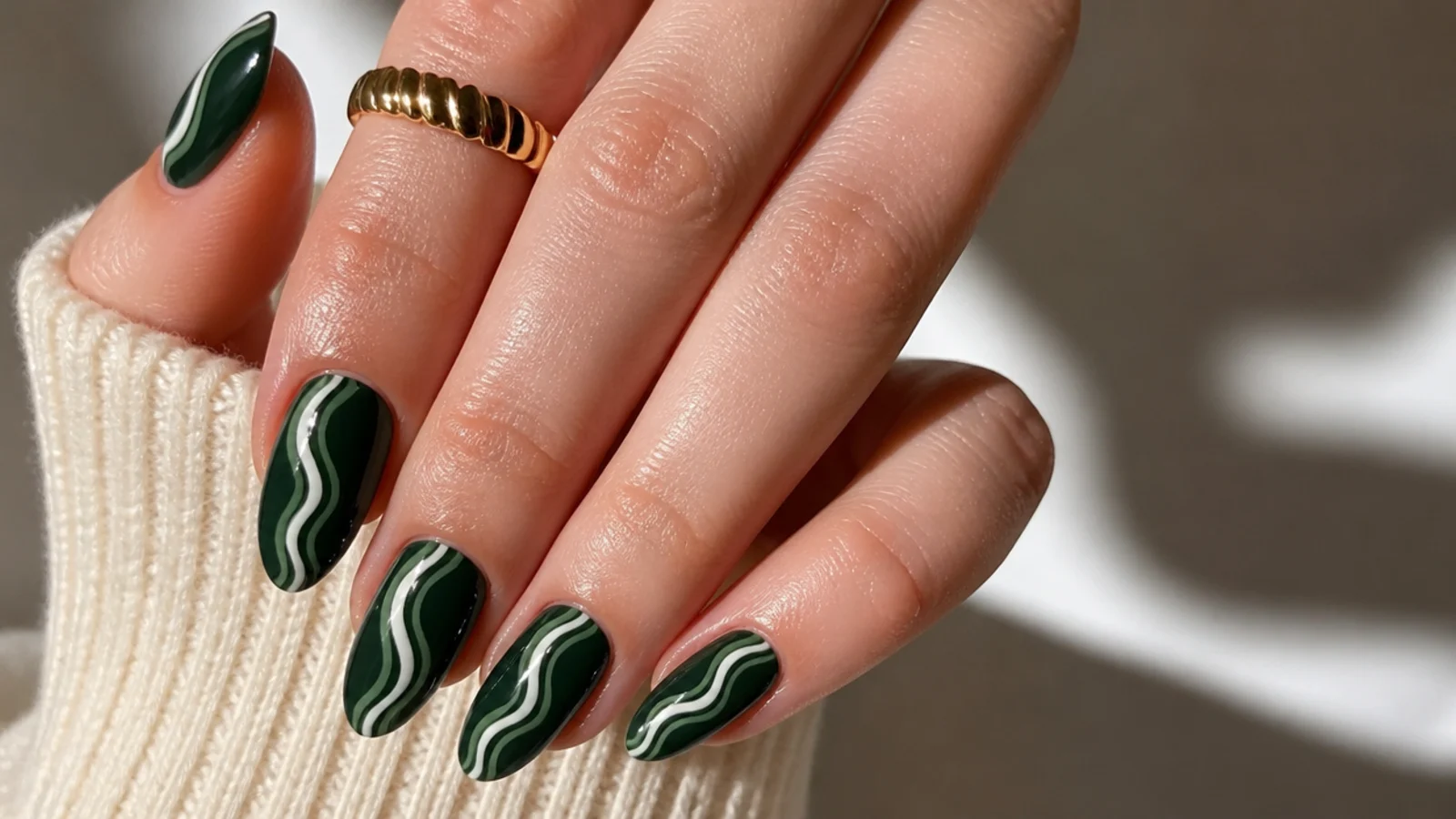 Dark green almond nails with retro white swirl lines