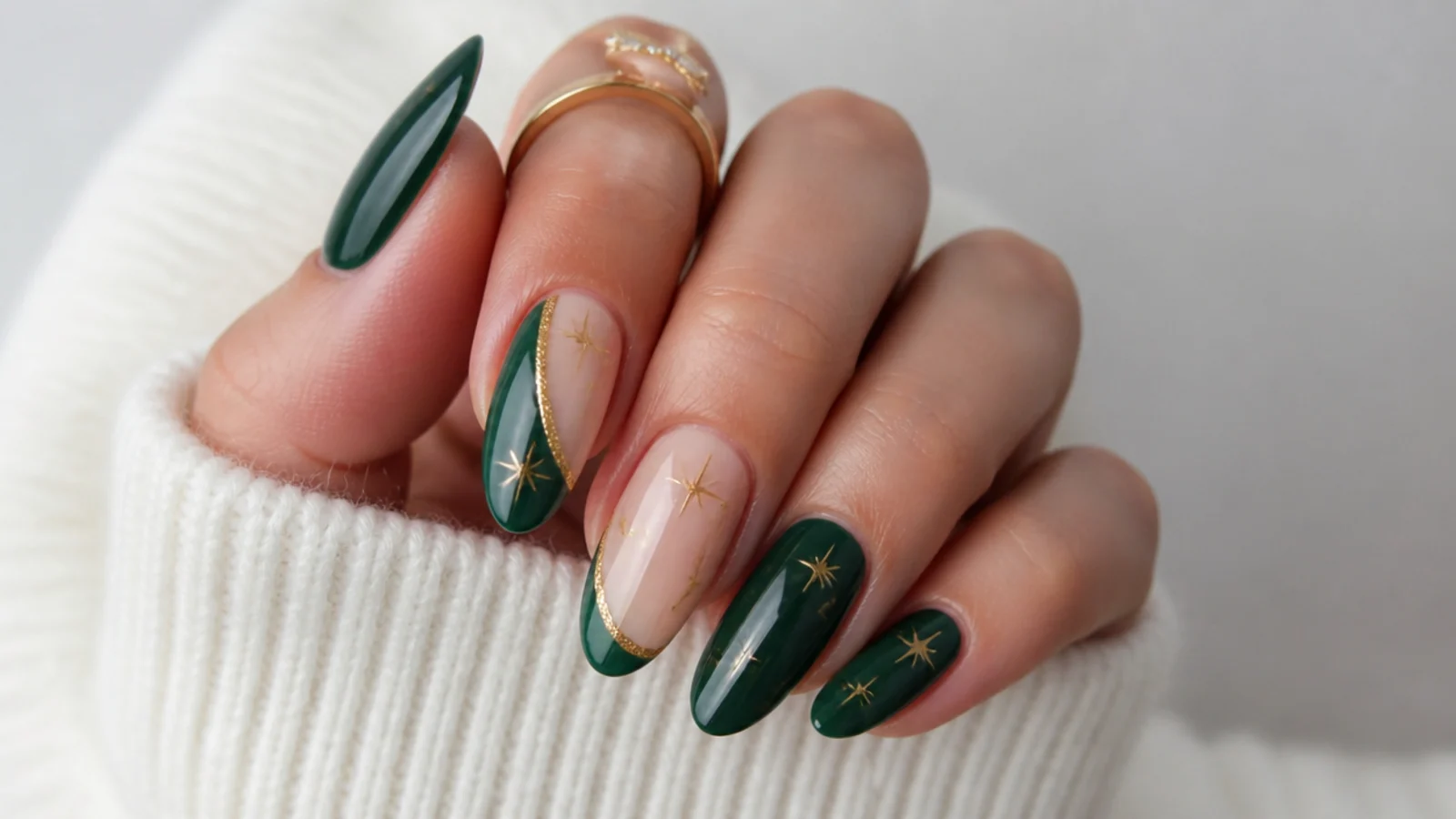 Dark green almond nails styled for fall, Christmas and New Year