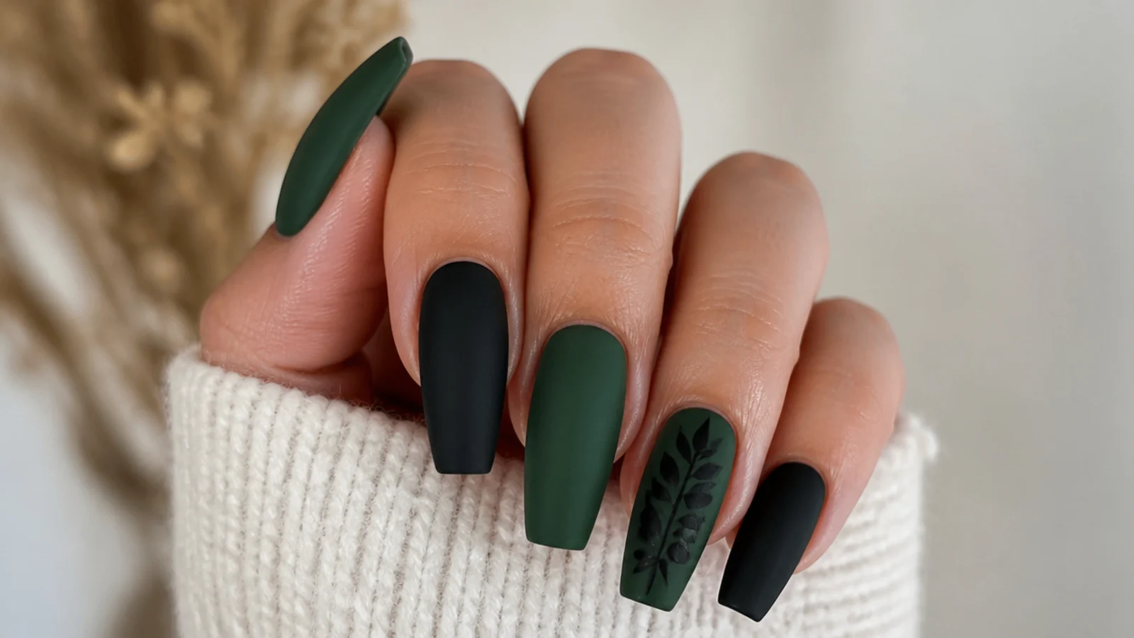 Flat matte forest green and black nails on a coffin shape