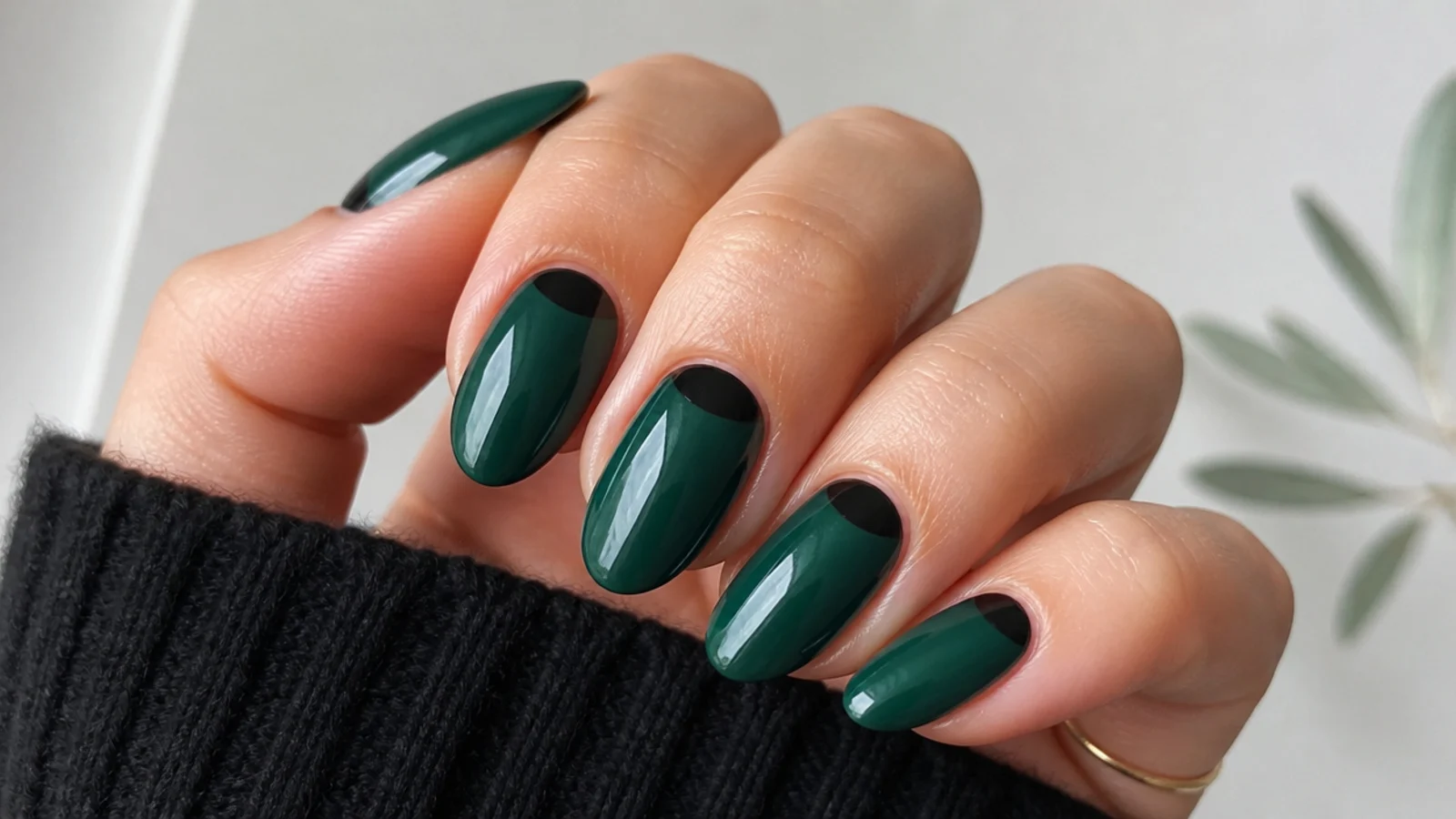 Emerald nails with black half-moon reverse french at the cuticle