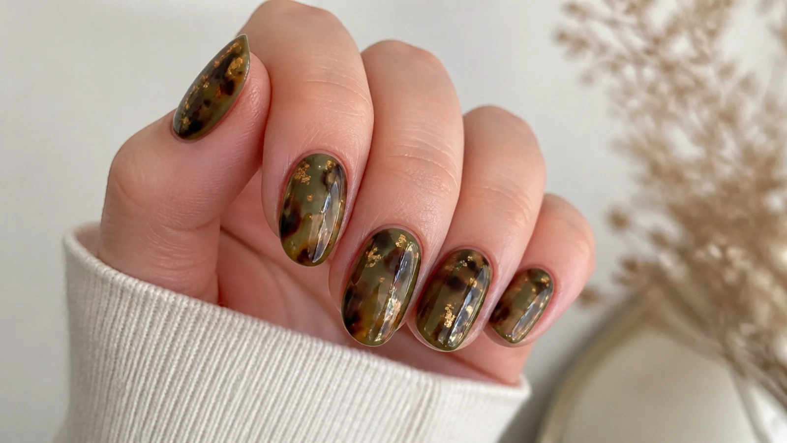 Warm olive green tortoiseshell nails with gold flecks