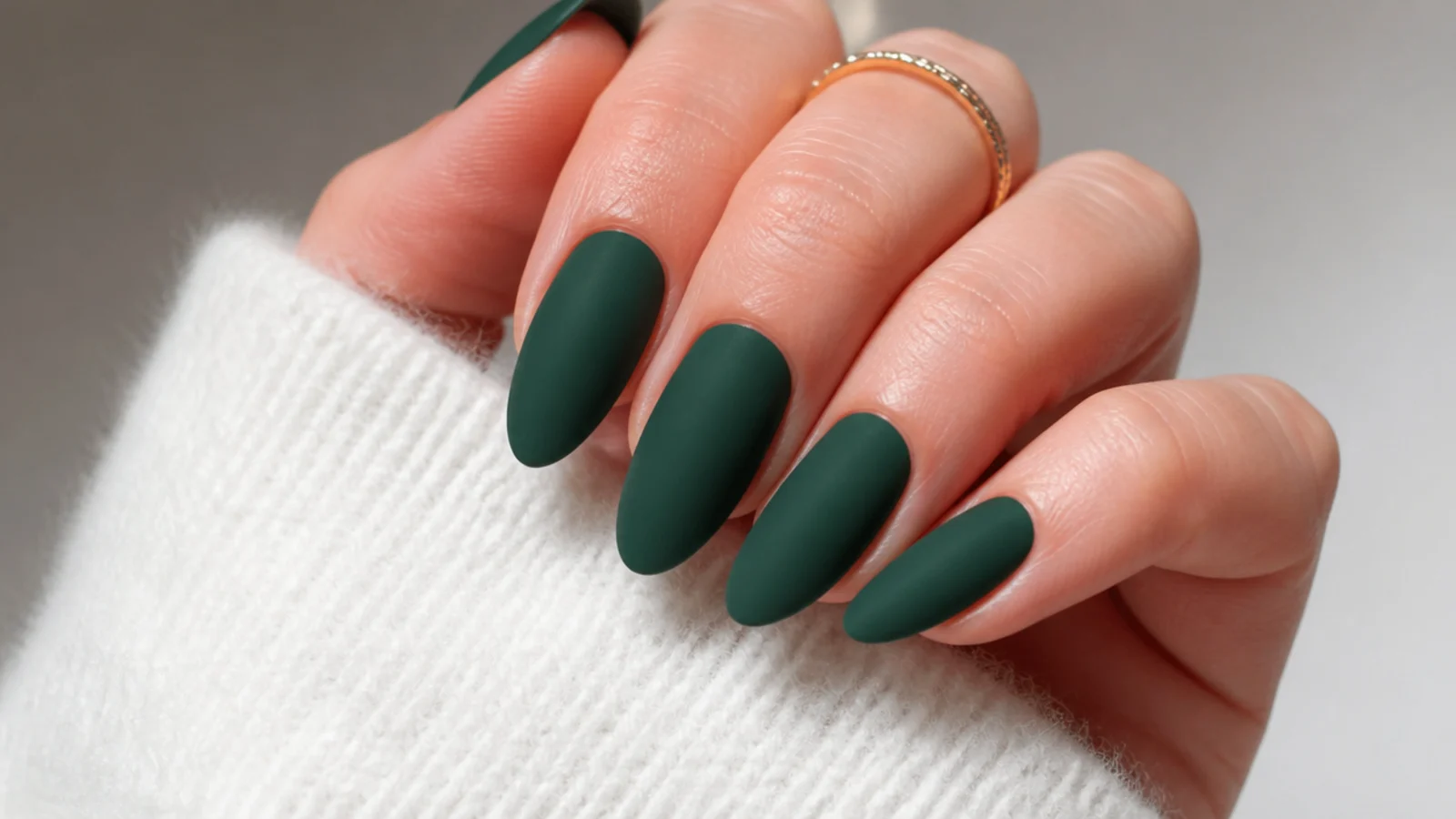 Deep matte pine green nails with a velvety flat finish