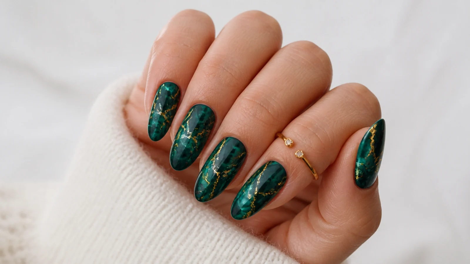Emerald green marble nails veined with thin gold foil lines