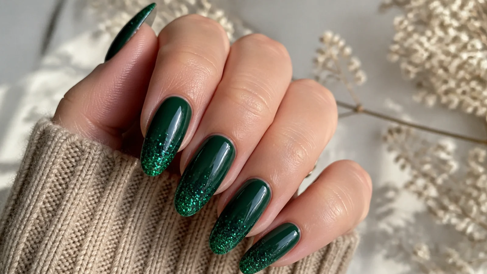 Forest green nails fading into dense emerald glitter at the tips