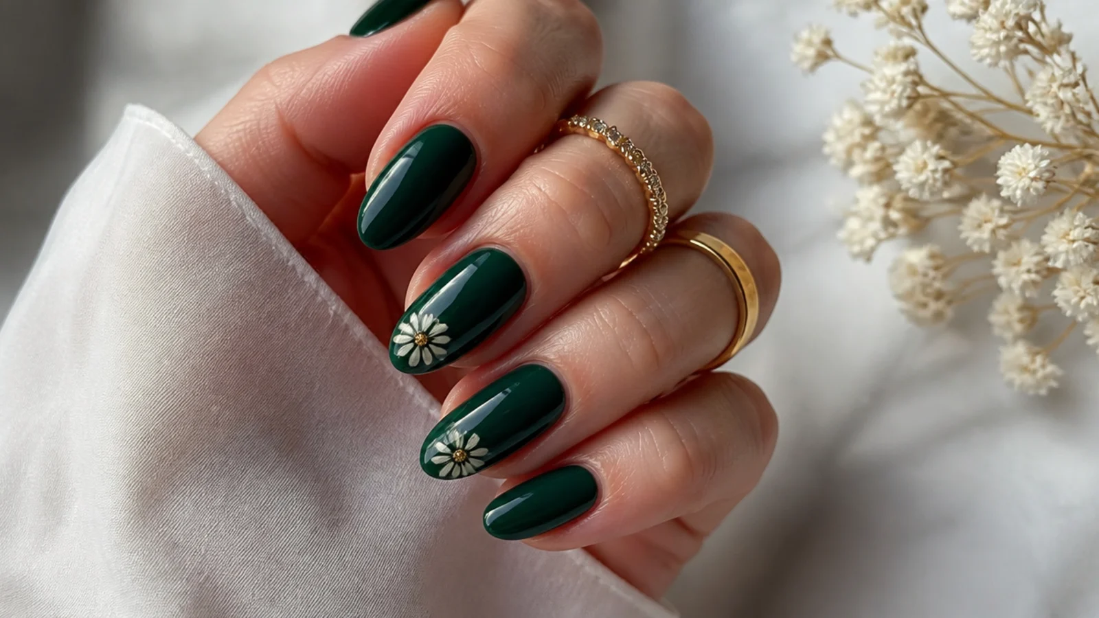 A well-sealed dark green gel manicure with cuticle oil